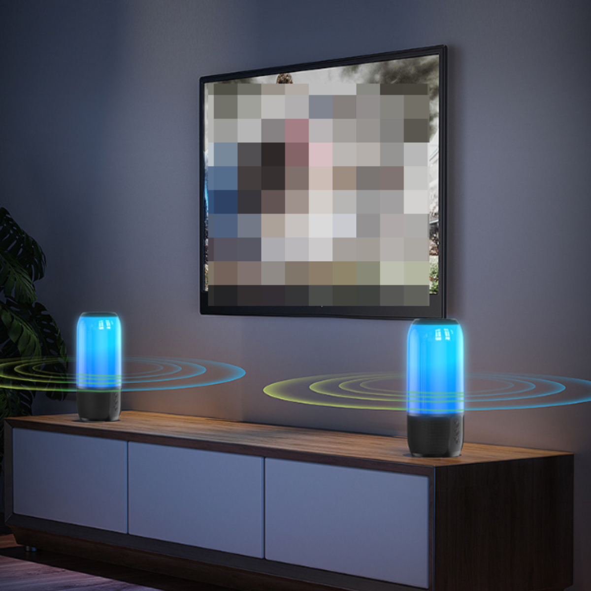 Zwei zylindrische Lautsprecher mit blauem Licht, auf einem Holzschrank platziert, im Hintergrund ein Fernseher.