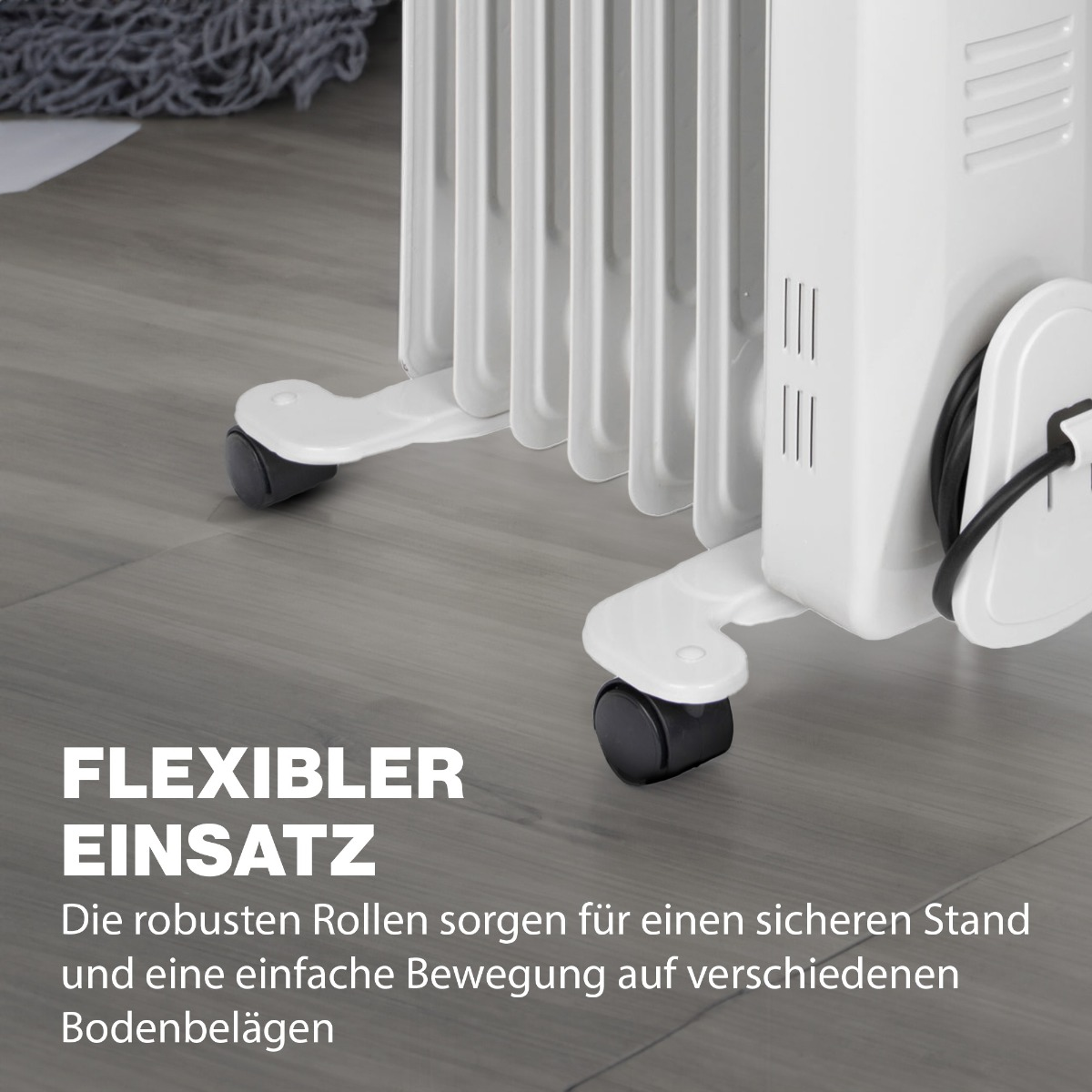 Biały grzejnik olejowy na szarej podłodze. Widoczne koła. Tekst mówi 'Elastyczne użycie'.