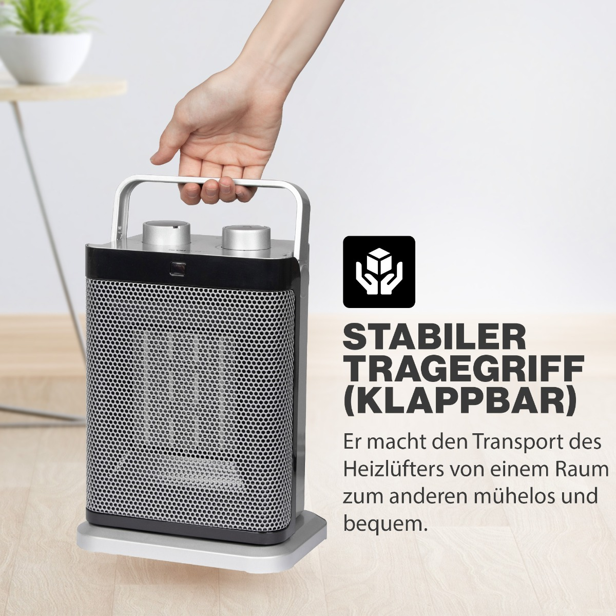Ręka trzyma przenośny grzejnik z tekstem: 'STABILER TRAGEGRIFF (KLAPPBAR)'
