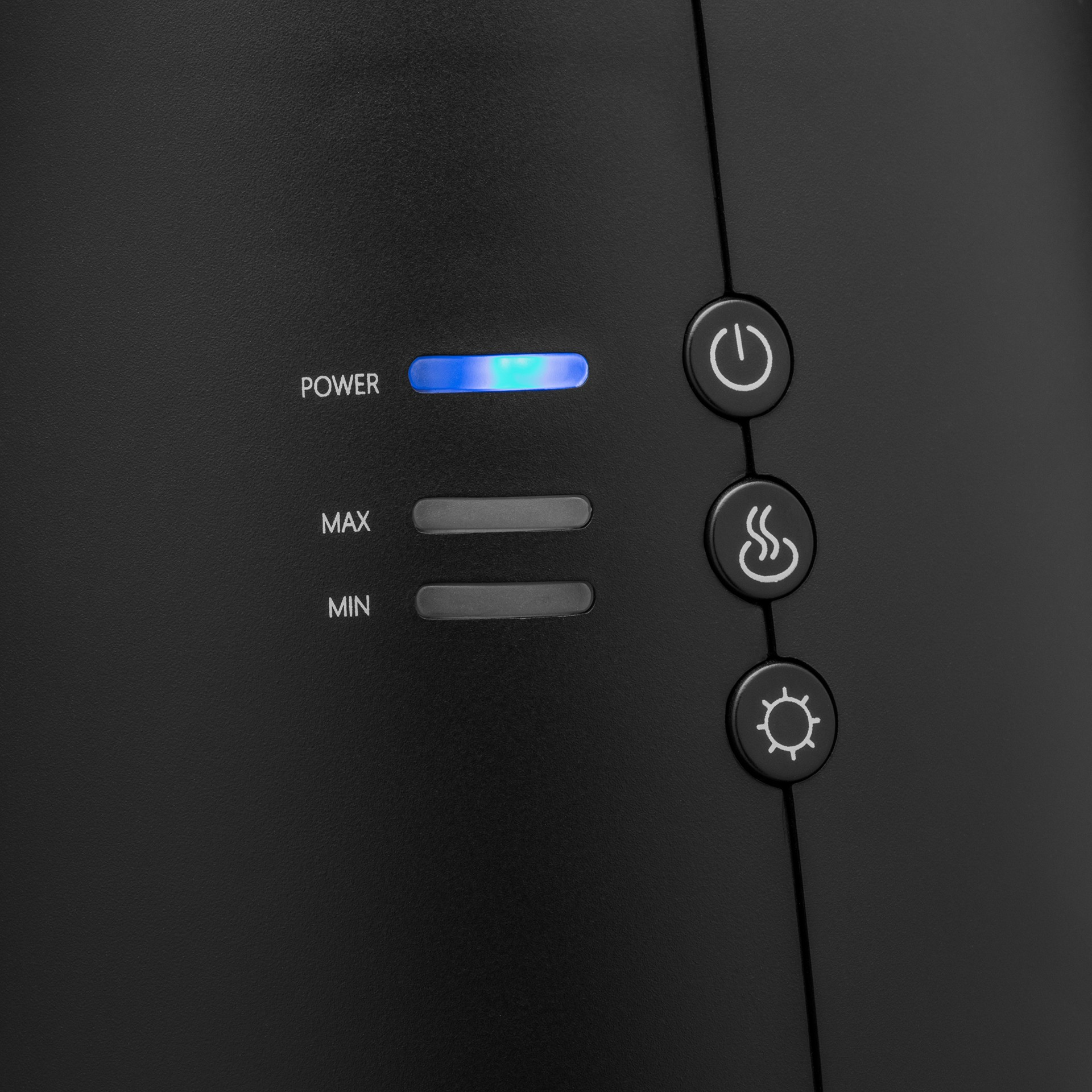 Zbliżenie czarnego urządzenia z trzema przyciskami: zasilanie, temperatura i światło.