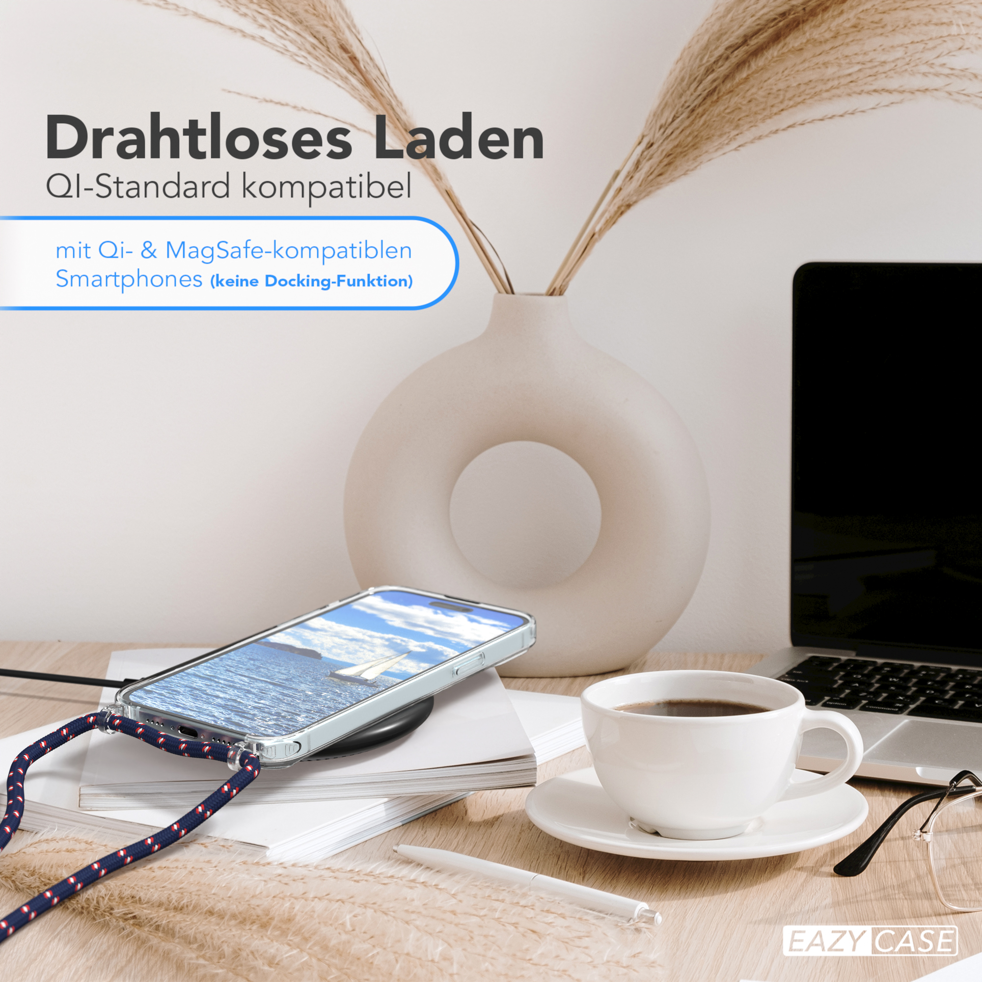 Ein Telefon, das auf einem Schreibtisch mit Kaffee geladen wird.