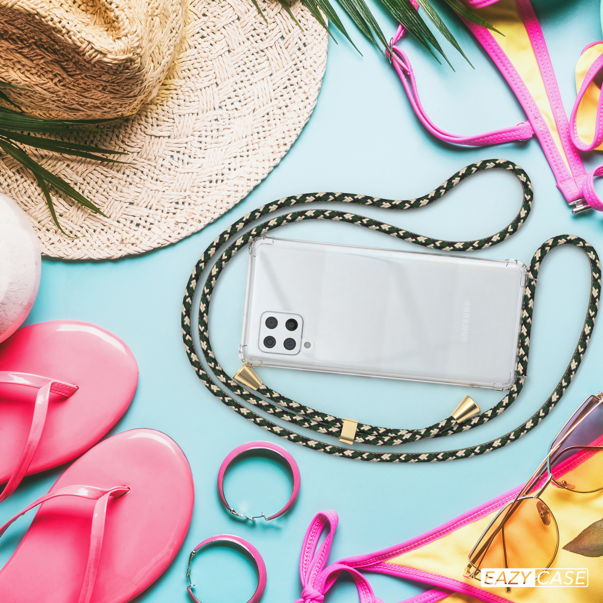 Telefon mit Hülle und grünem Gurt, Strandszene, Sonnenbrille, Strohhut.