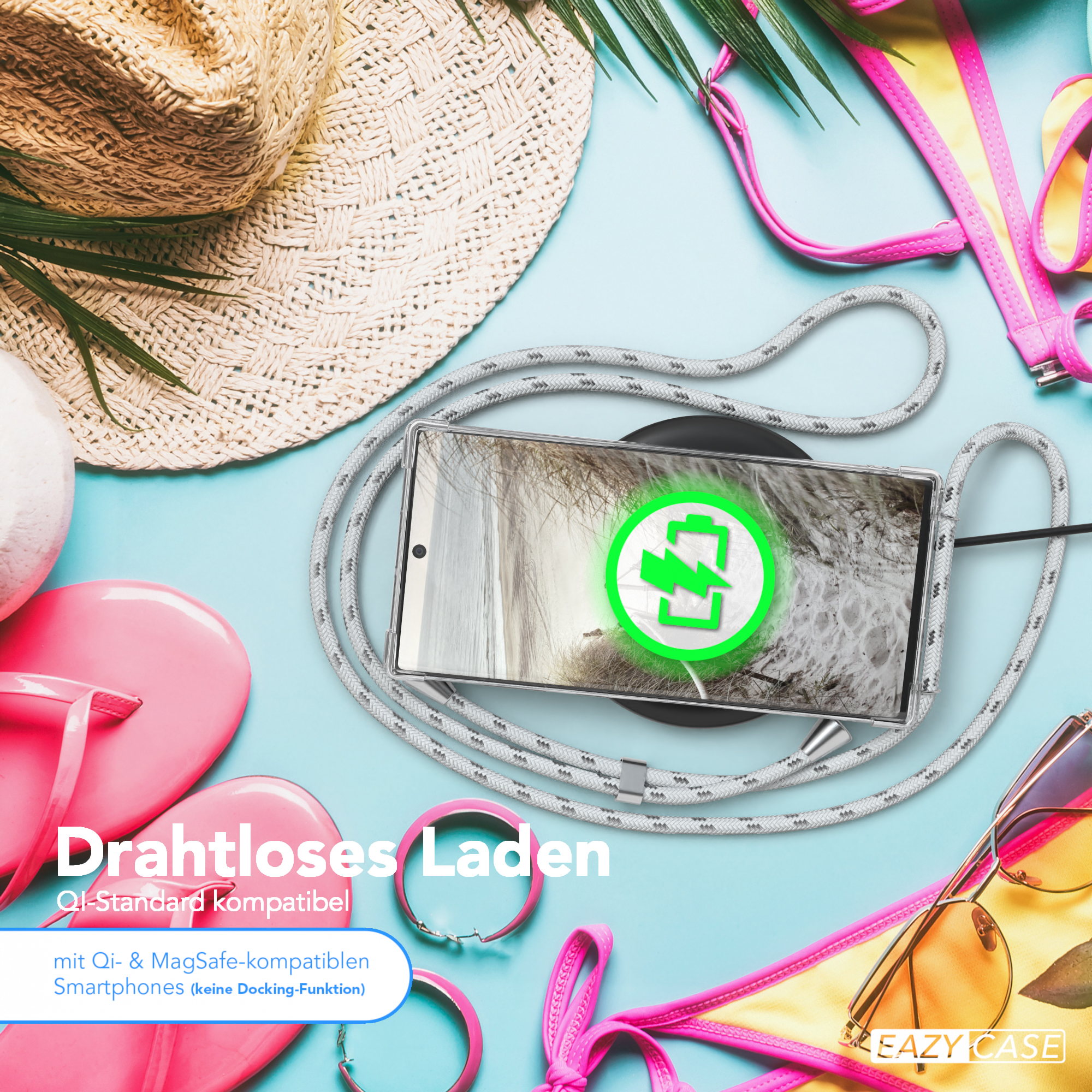Telefon mit kabellosem Laden auf einer Strandszene mit Strandaccessoires. Hut, Sonnenbrille und Flip-Flops.