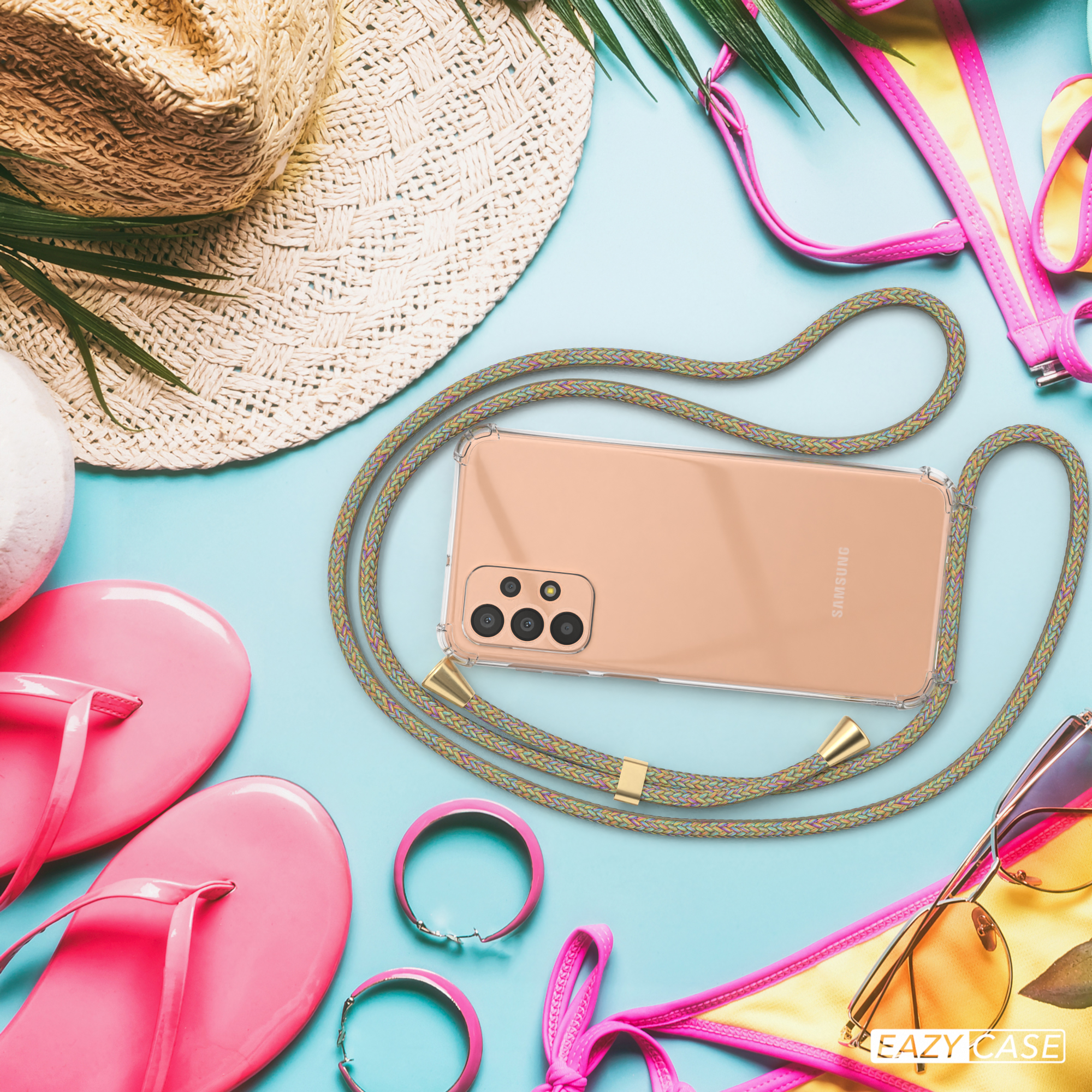 Telefon mit Lanyard, Sonnenbrille und Strandaccessoires liegen auf blauem Untergrund. Eazy Case-Logo unten.
