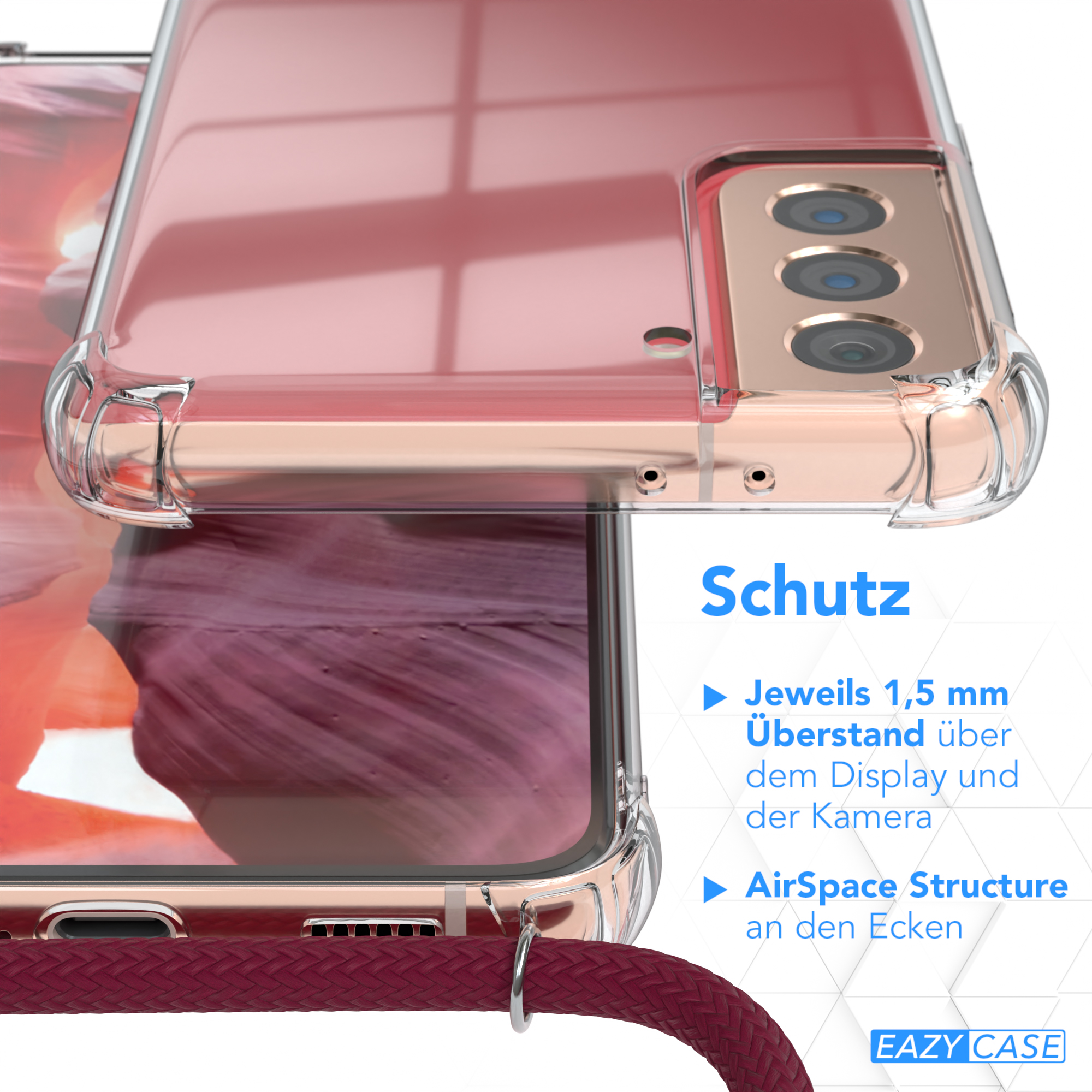 Nahaufnahme einer durchsichtigen Handyhülle über einem Telefon mit rosa Rückseite und goldenen Details.
