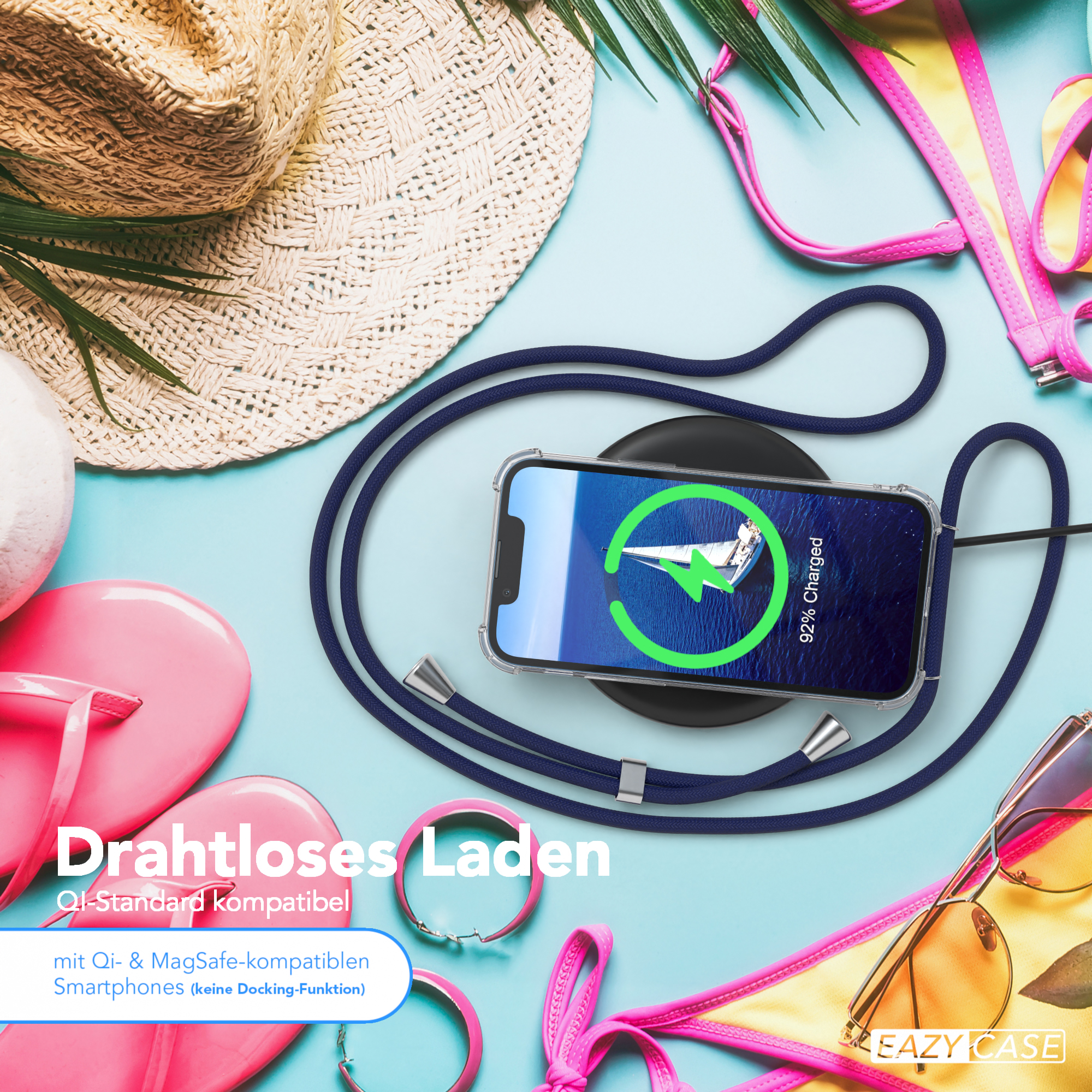 Strandszene mit Ladetelefon. Accessoires wie Hut, Sonnenbrille und rosa Flip-Flops sind vorhanden.