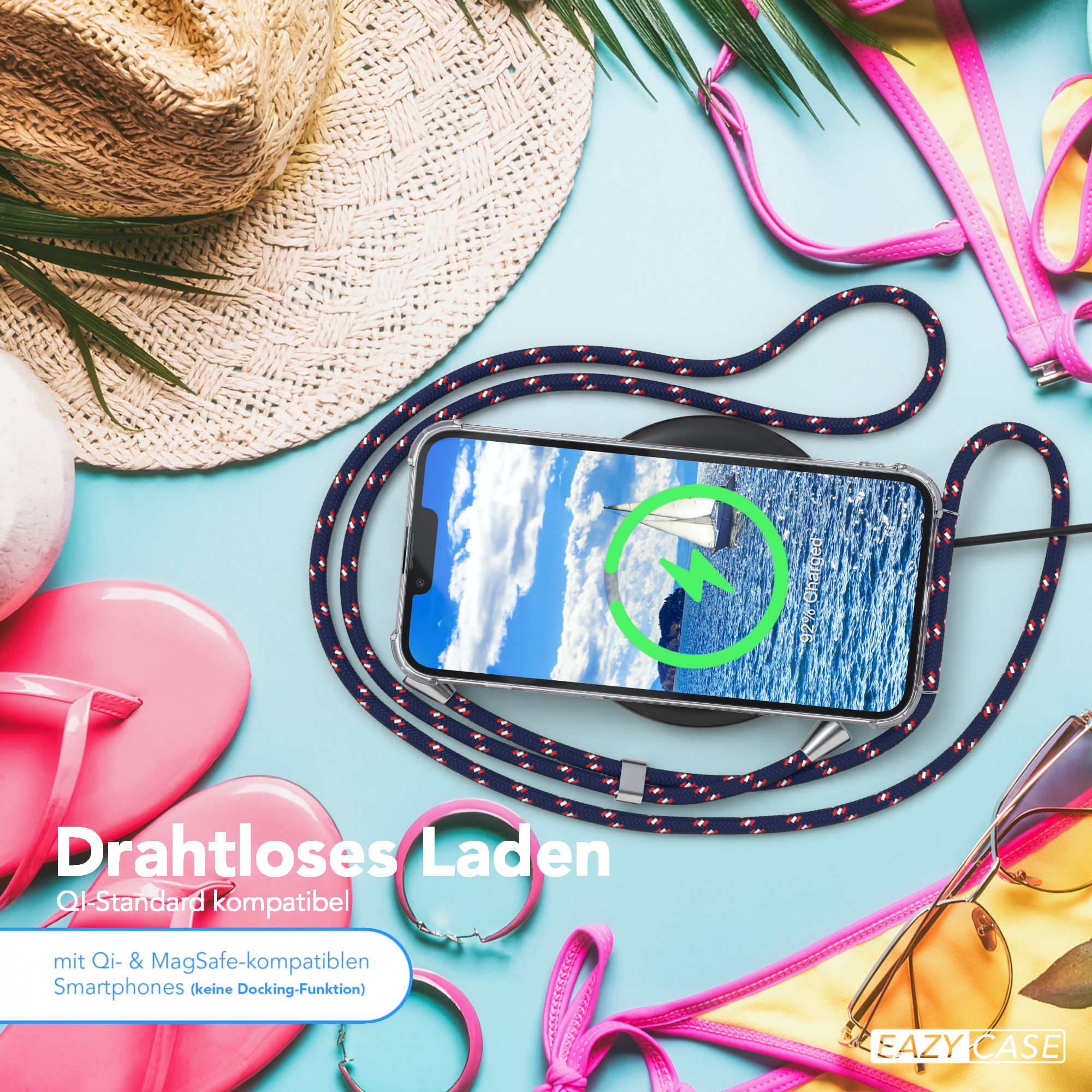 Telefon auf Ladegerät mit Lanyard, Strandhintergrund. Sonnenbrille und Zubehör.