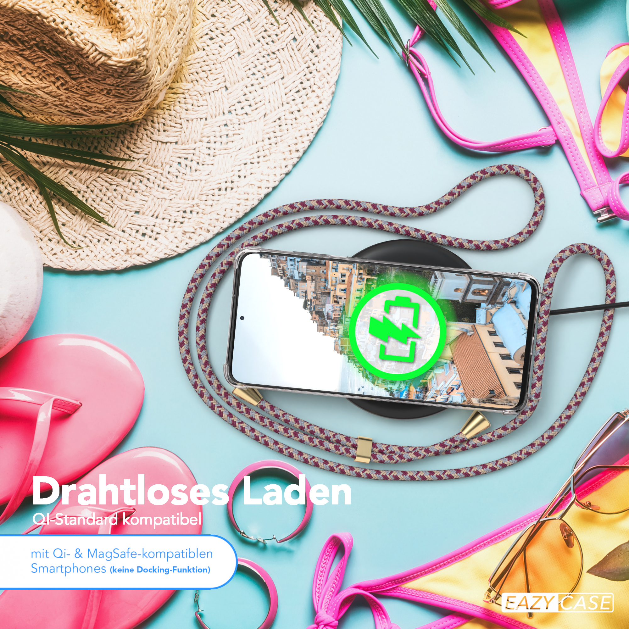 Telefon lädt mit Kabel und Hülle, am Strand mit Zubehör, kabelloses Laden.