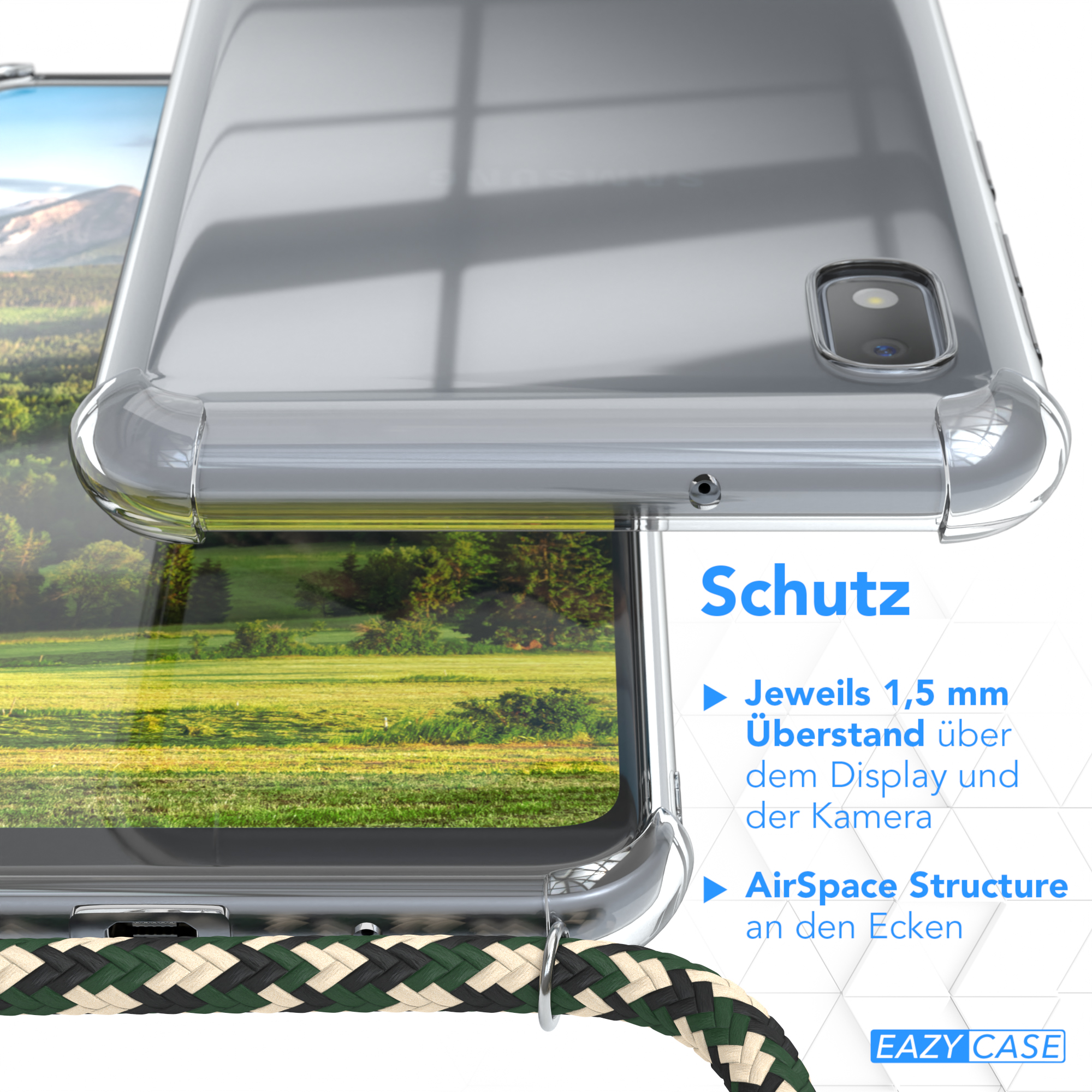 Nahaufnahme einer Handyhülle mit grün-beigem Kordel. Der Hintergrund ist eine Landschaft.
