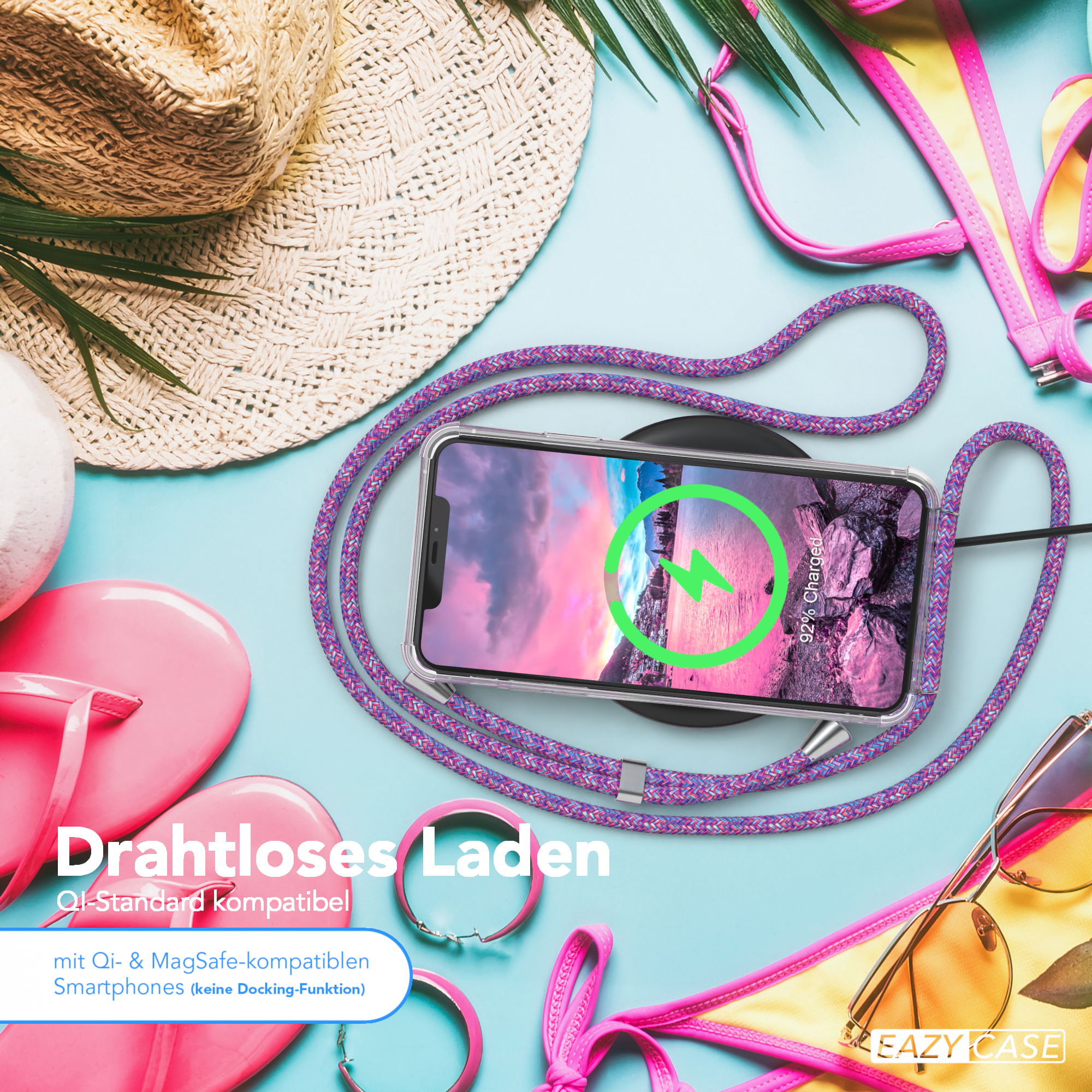 Telefon und Ladegerät auf blauer Oberfläche. Sonnenbrille und andere Artikel sind sichtbar.