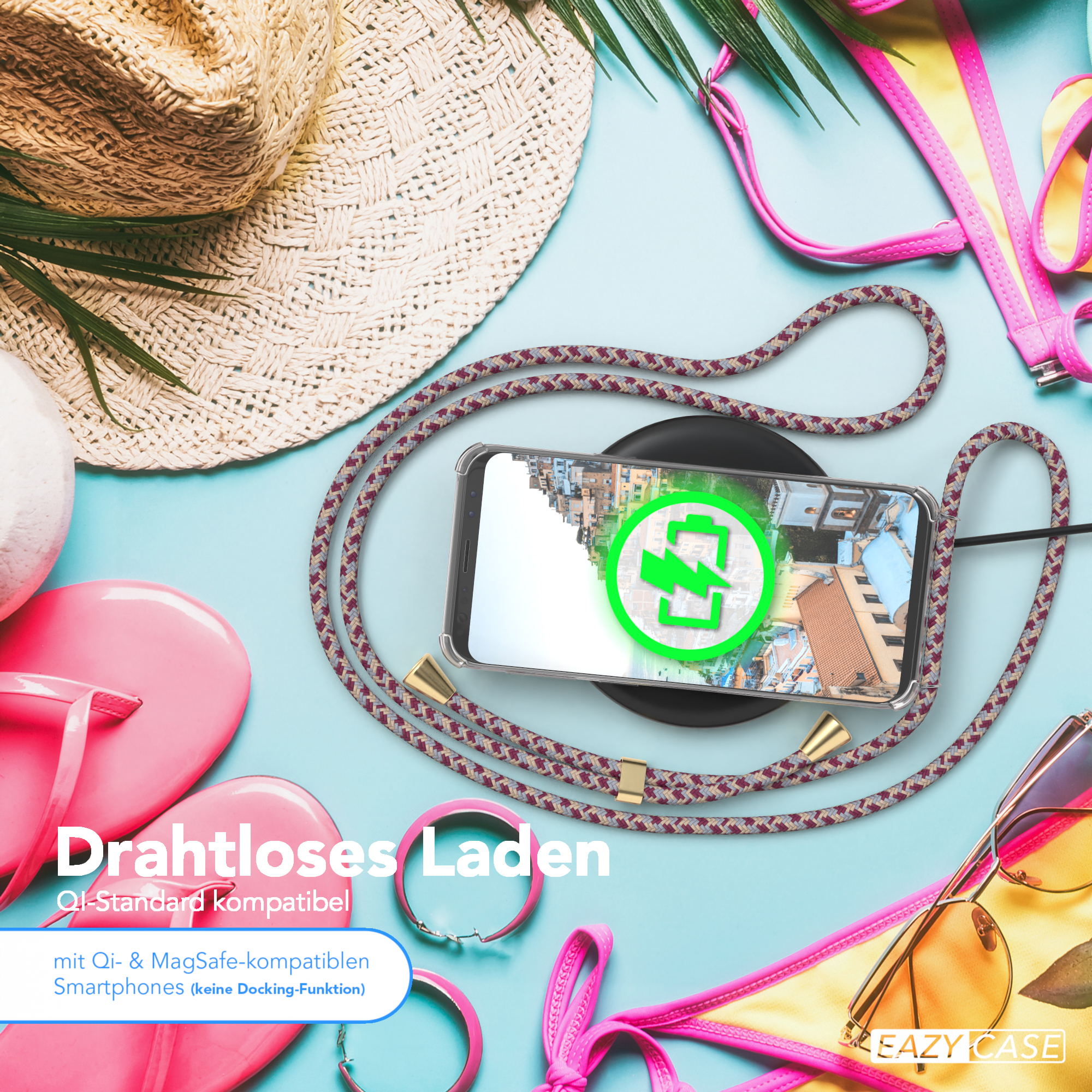 Telefon mit Hülle, kabelloses Laden. Strandartikel: Hut, Sonnenbrille und rosa Accessoires.