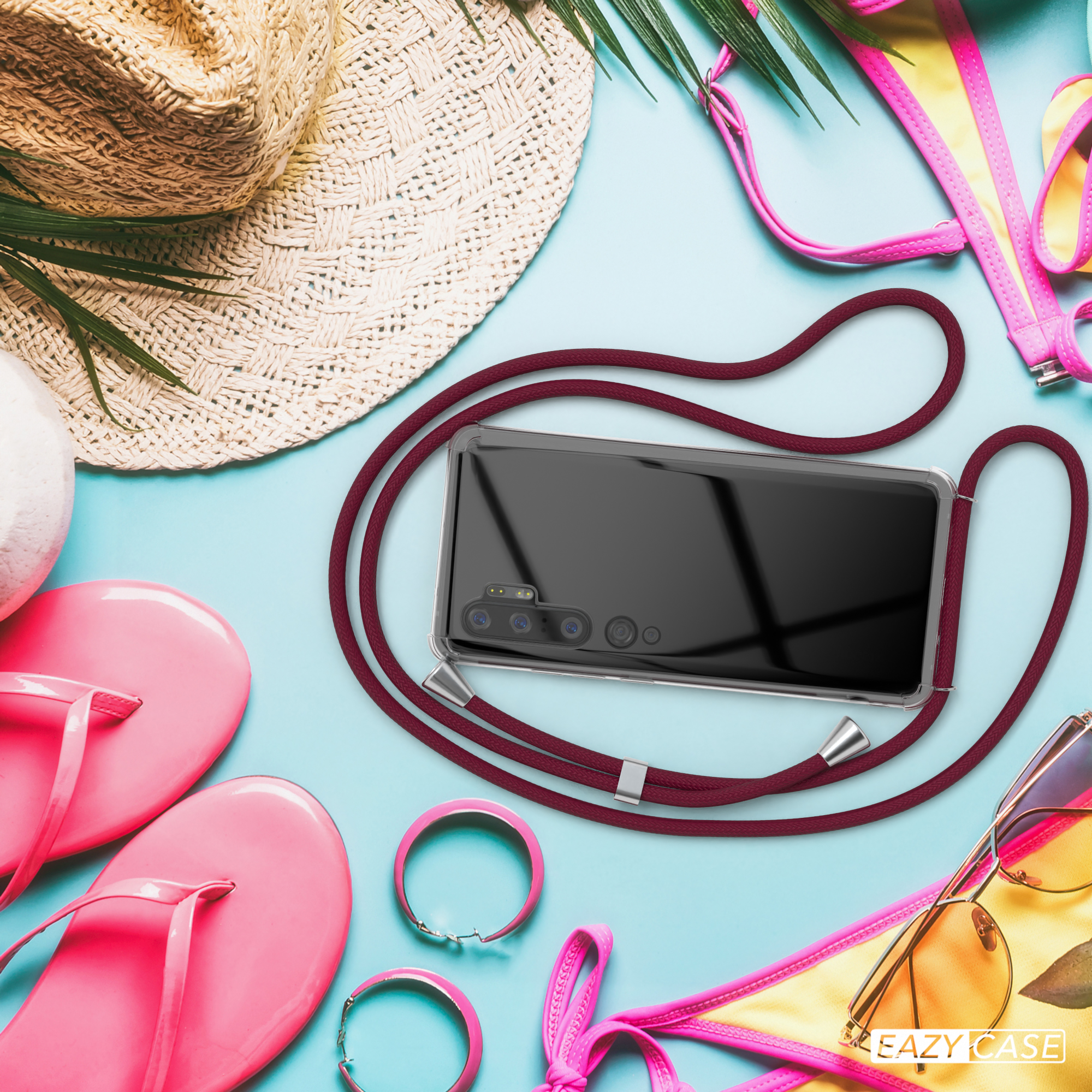Telefon mit Hülle und Lanyard, Strandaccessoires und Text: EAZY CASE.