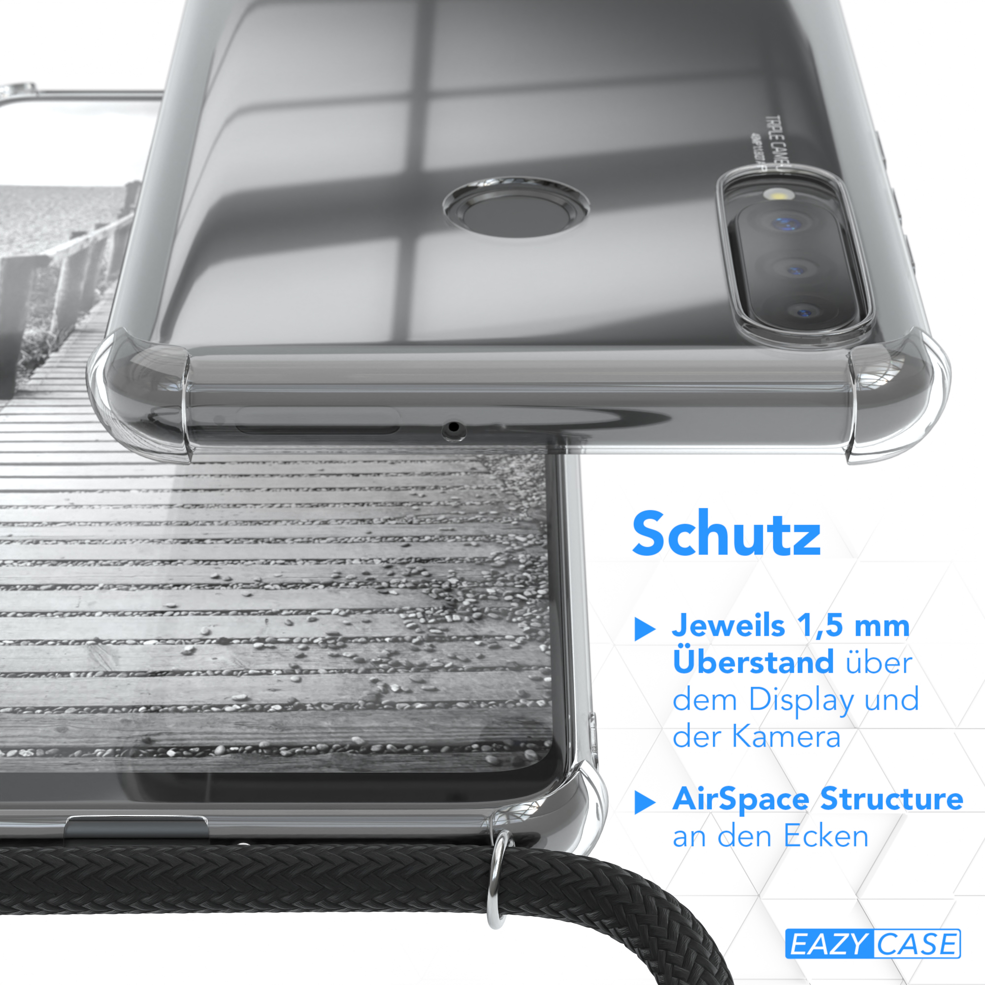 Nahaufnahme einer Handyhülle. Text sagt Schutz. Schwarzes Kabel. Holzdeck-Hintergrund.