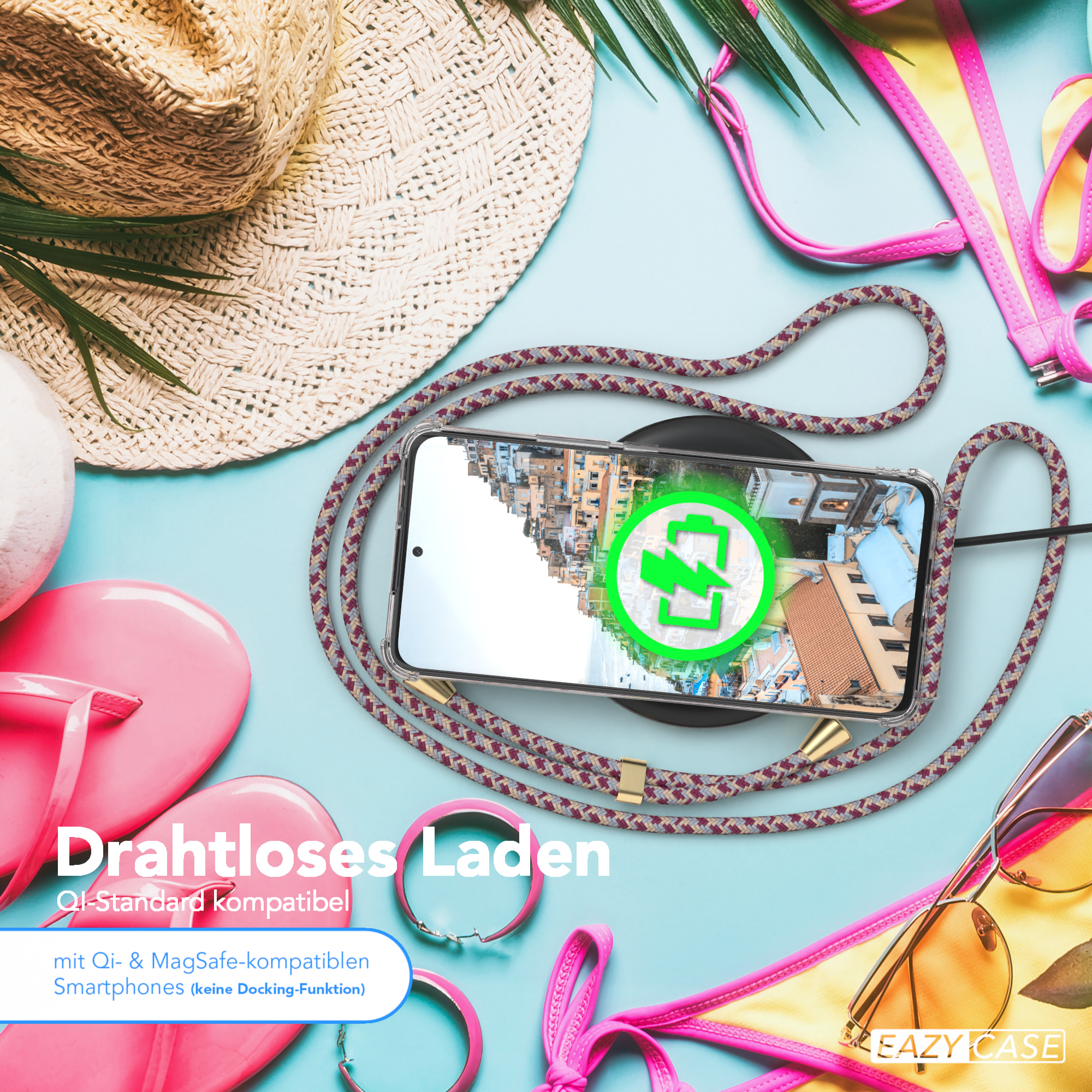Telefon mit Ladekabel und Zubehör auf blauem Hintergrund.