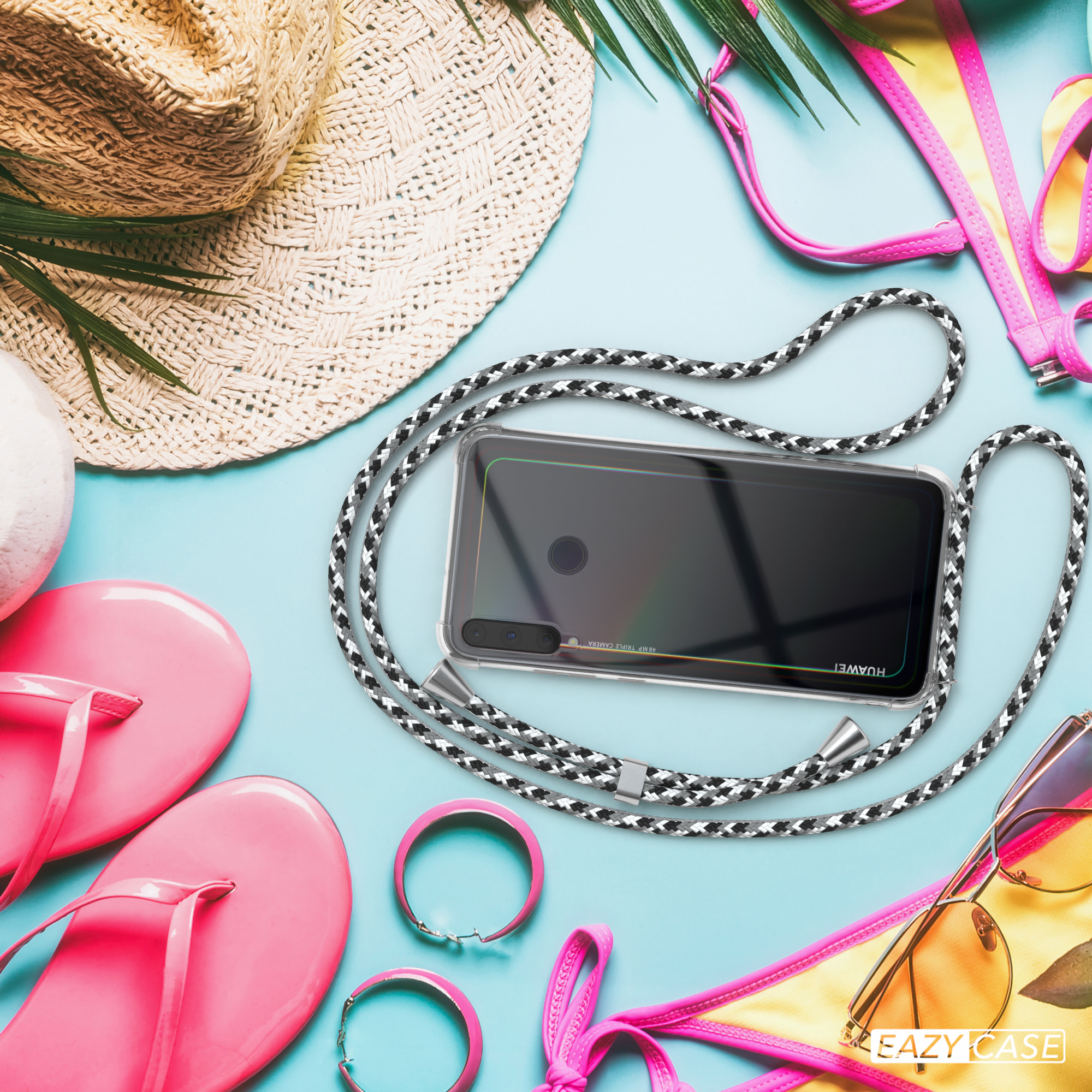 Telefon auf blauem Grund mit Strandaccessoires. Telefon hat klare Hülle und schwarz-weißes Band.