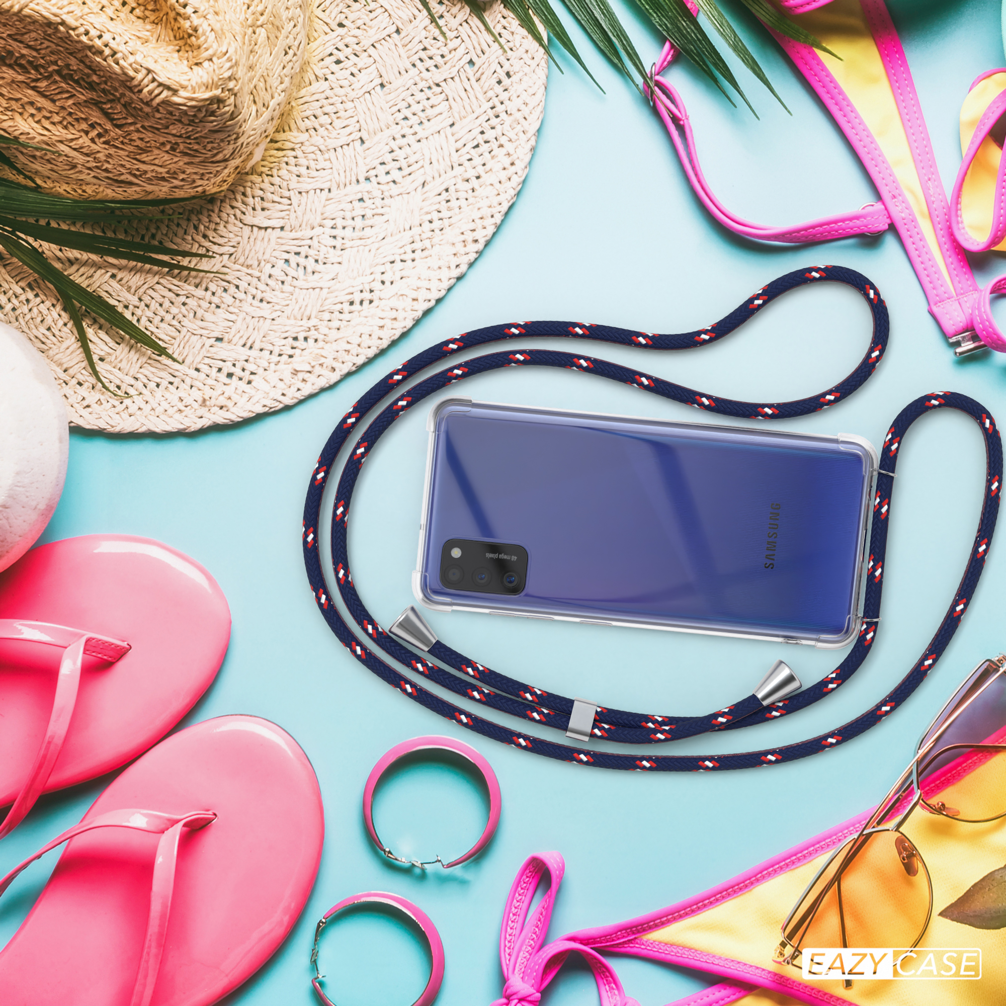 Telefon mit blauem Gehäuse und Seil, neben Strandaccessoires.