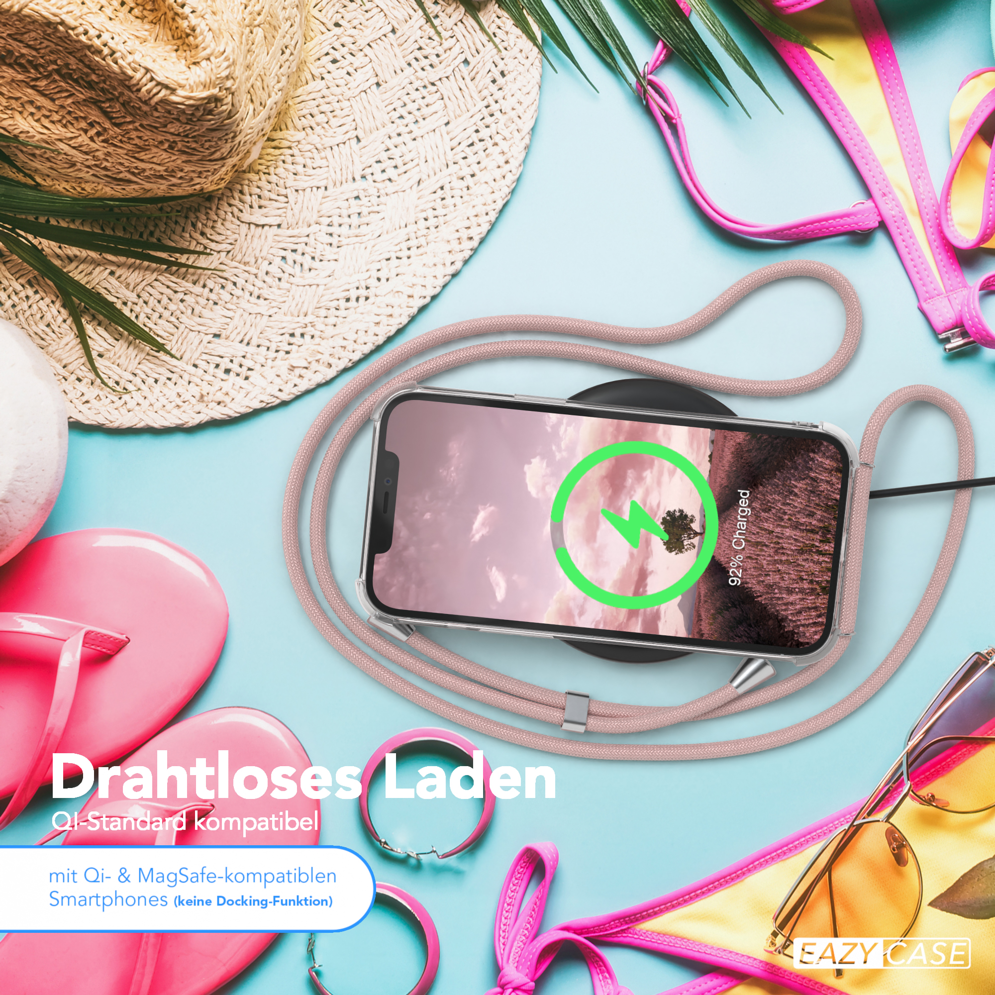 Telefon auf kabellosem Ladegerät, Strandszene mit Accessoires.