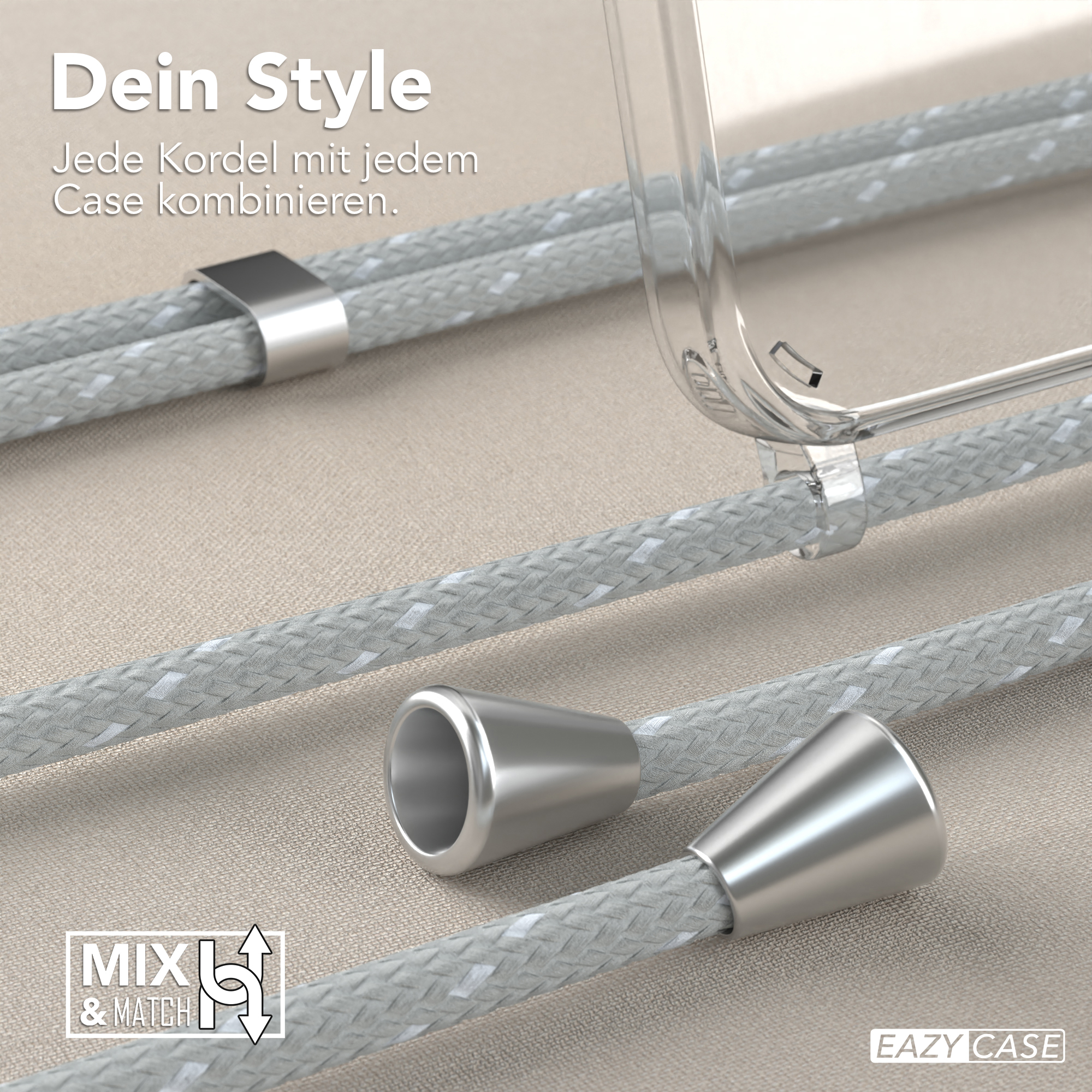 Nahaufnahme von Handykordeln mit silbernen Metallverbindern und einer transparenten Handyhülle. Beige Hintergrund.