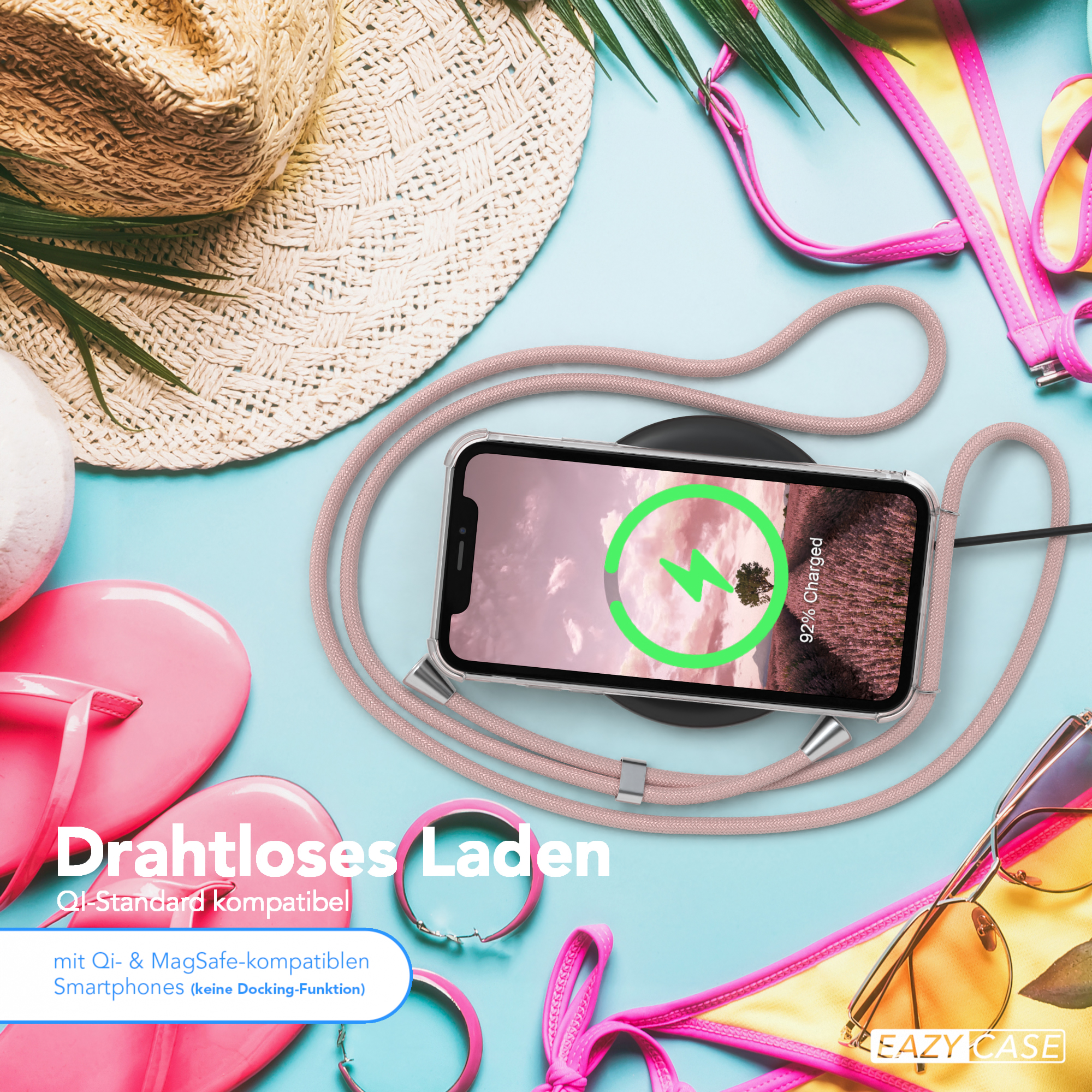 Telefon lädt kabellos. Strandaccessoires wie Hut, Sonnenbrille und Flip-Flops.