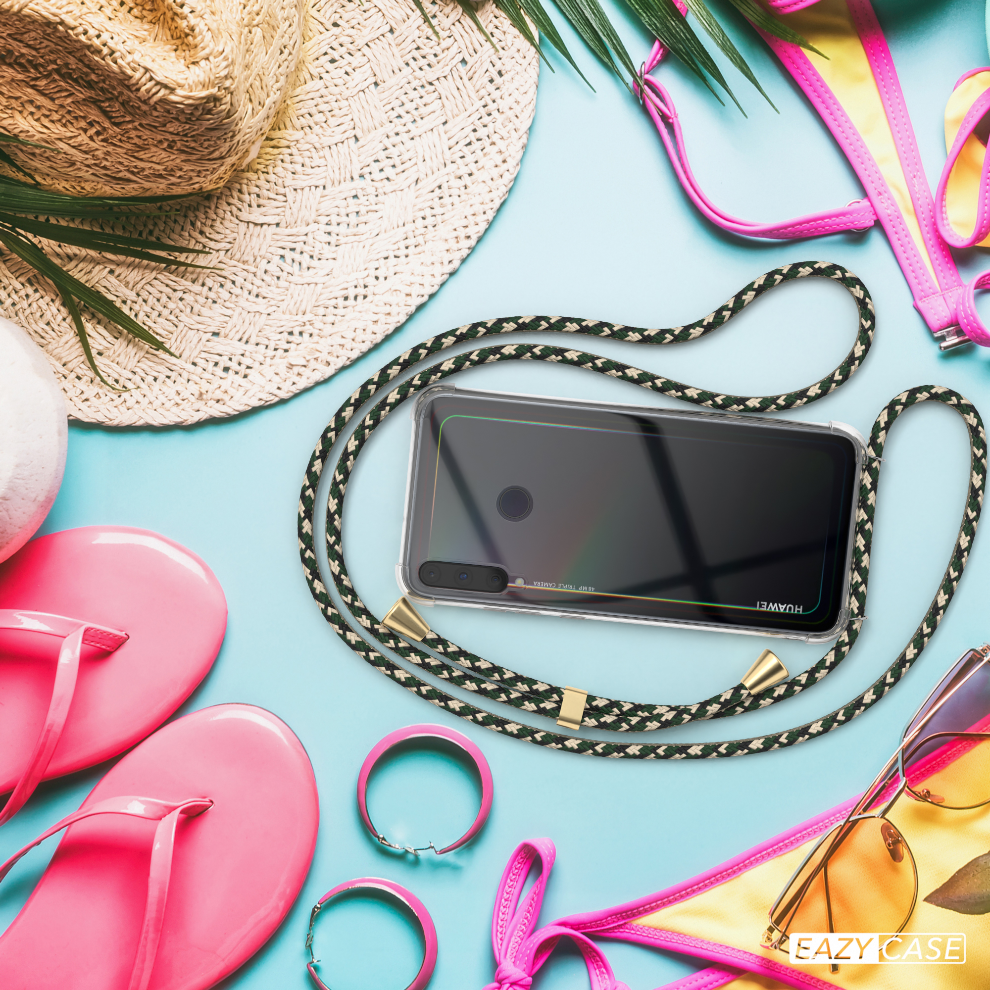 Telefon mit grün/schwarzem Band auf blauem Untergrund mit Sommeraccessoires.
