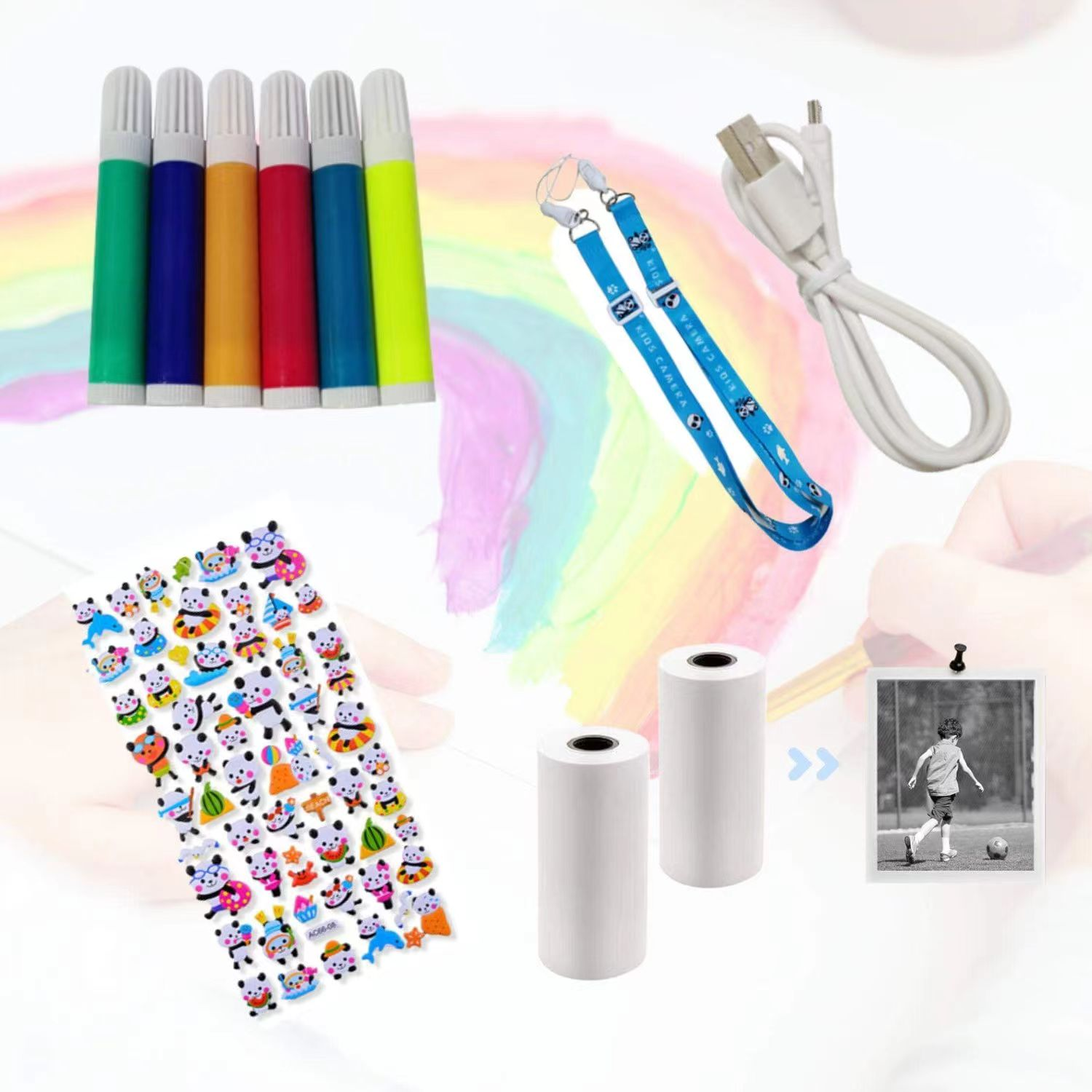 Juego de rotuladores de colores, pegatinas, cordón, cable cargador, rollos de papel térmico y una foto.