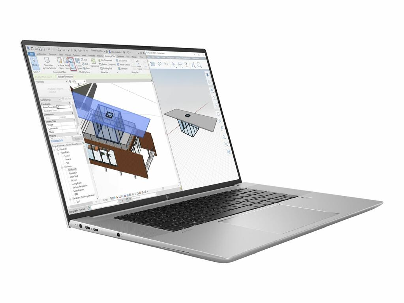 Silberner Laptop mit Architektursoftware. Zeigt ein 3D-Modell eines Gebäudes.