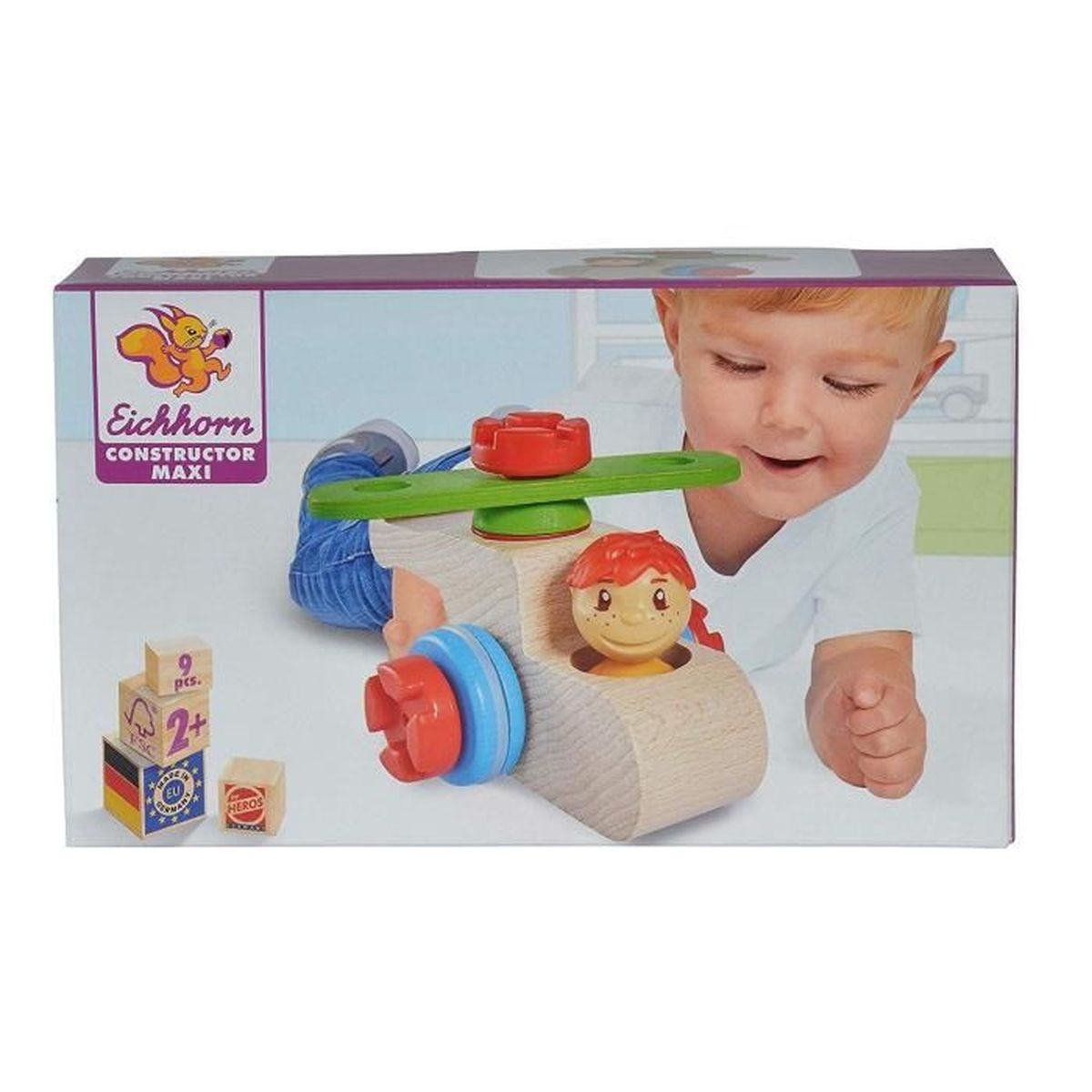 Dziecko bawi się zabawką helikopterem. Pudełko pokazuje zabawkę i wizerunek dziecka.