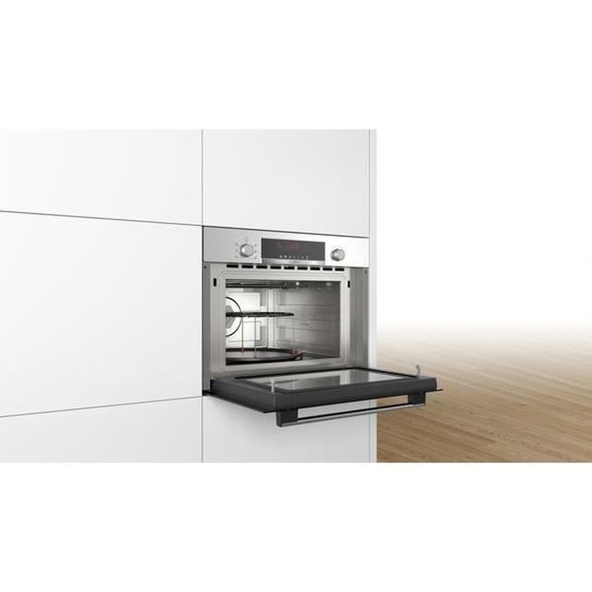 Built-in oven, stainless steel, open door. White cabinets in the background.