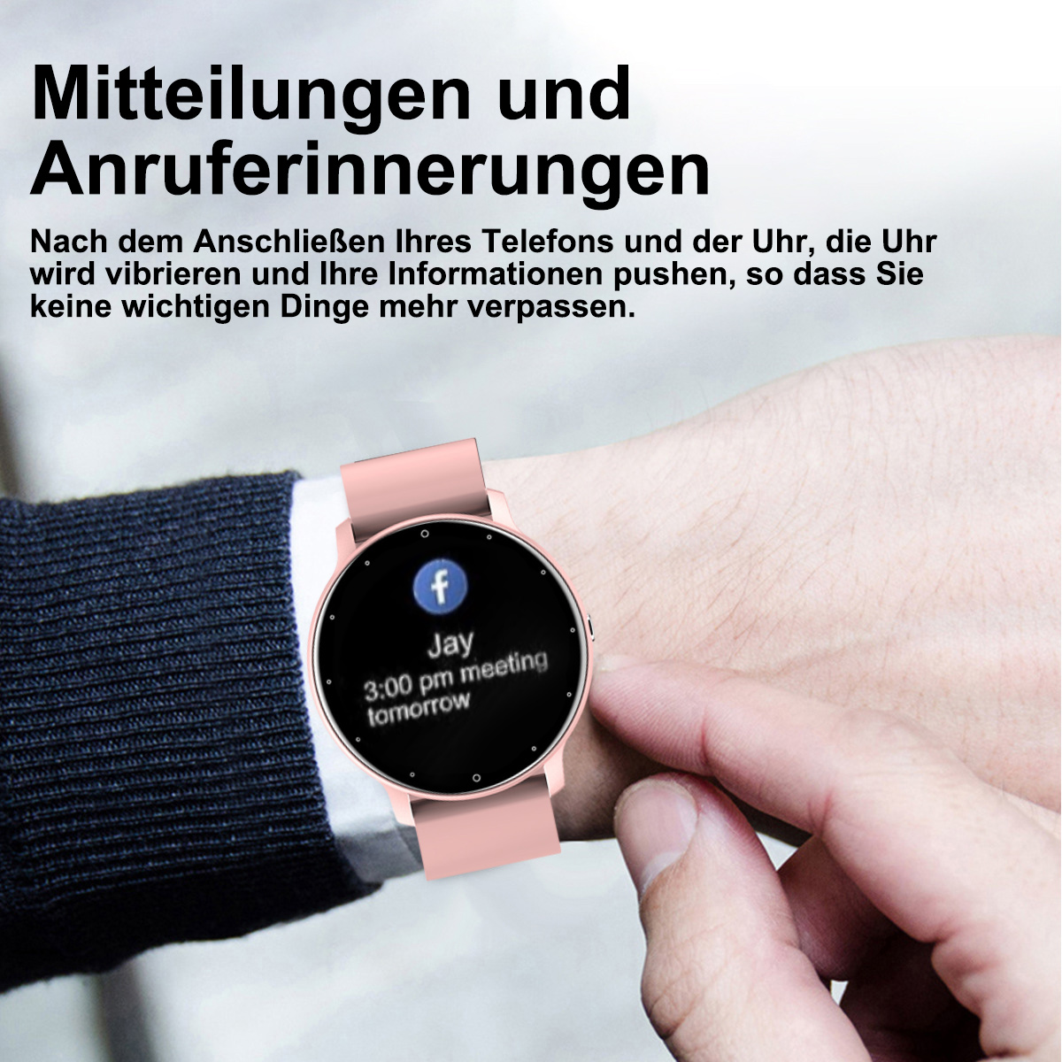 Rosafarbene Smartwatch am Handgelenk, die eine Terminerinnerung anzeigt. Text auf Deutsch.