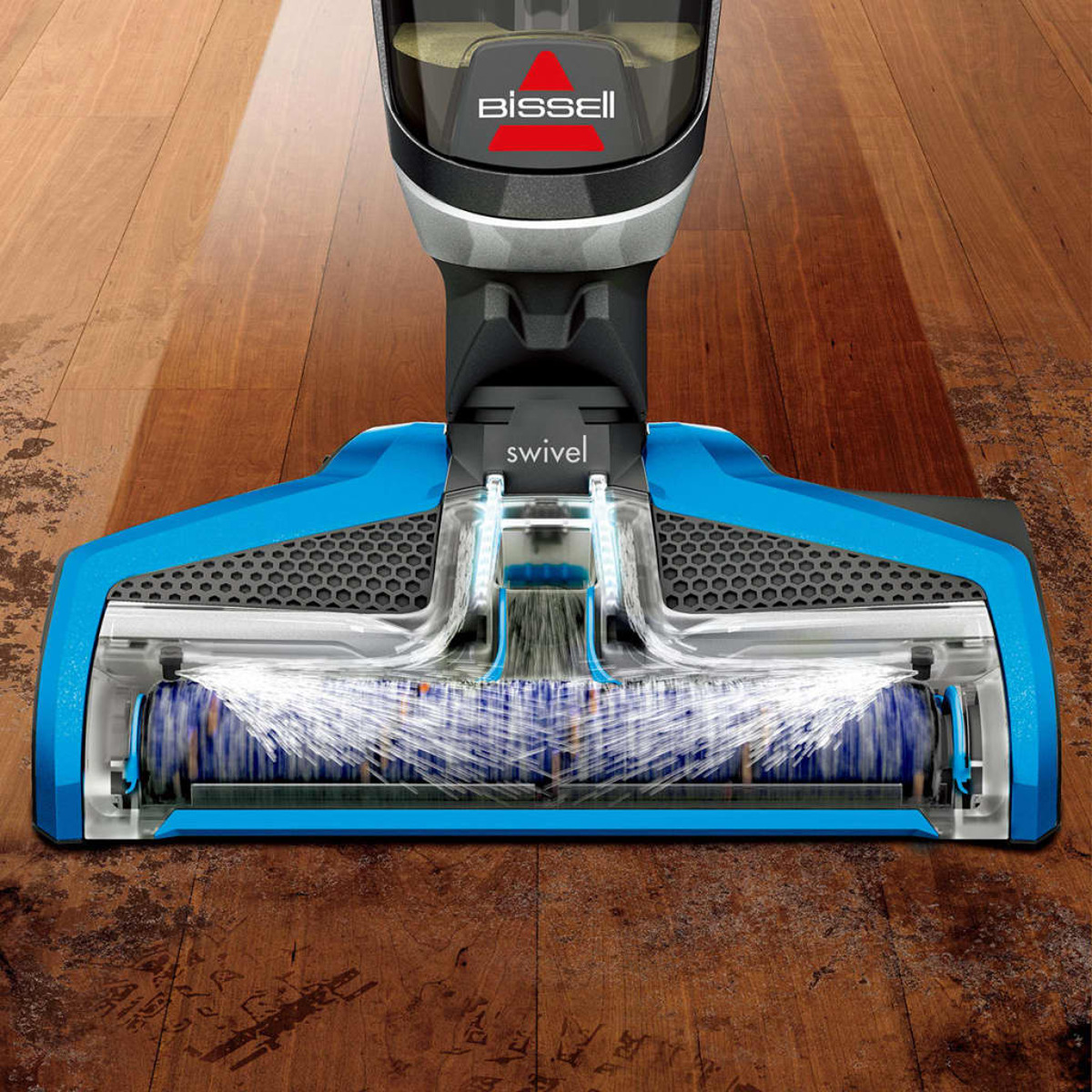 Nahaufnahme eines blauen und schwarzen Bodenreinigers, mit Bissell-Logo, auf Holzboden.