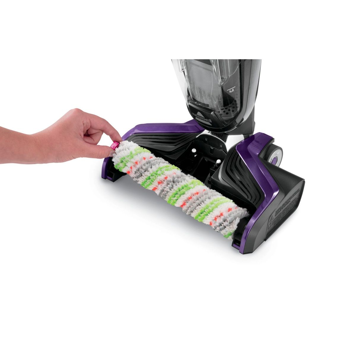 Die Hand einer Person, die eine Walzenbürste aus einem lila-schwarzen Staubsauger entfernt.