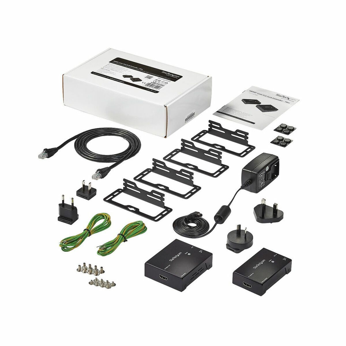 Eine Box mit elektronischen Teilen, darunter Kabel, Halterungen und Netzadapter.