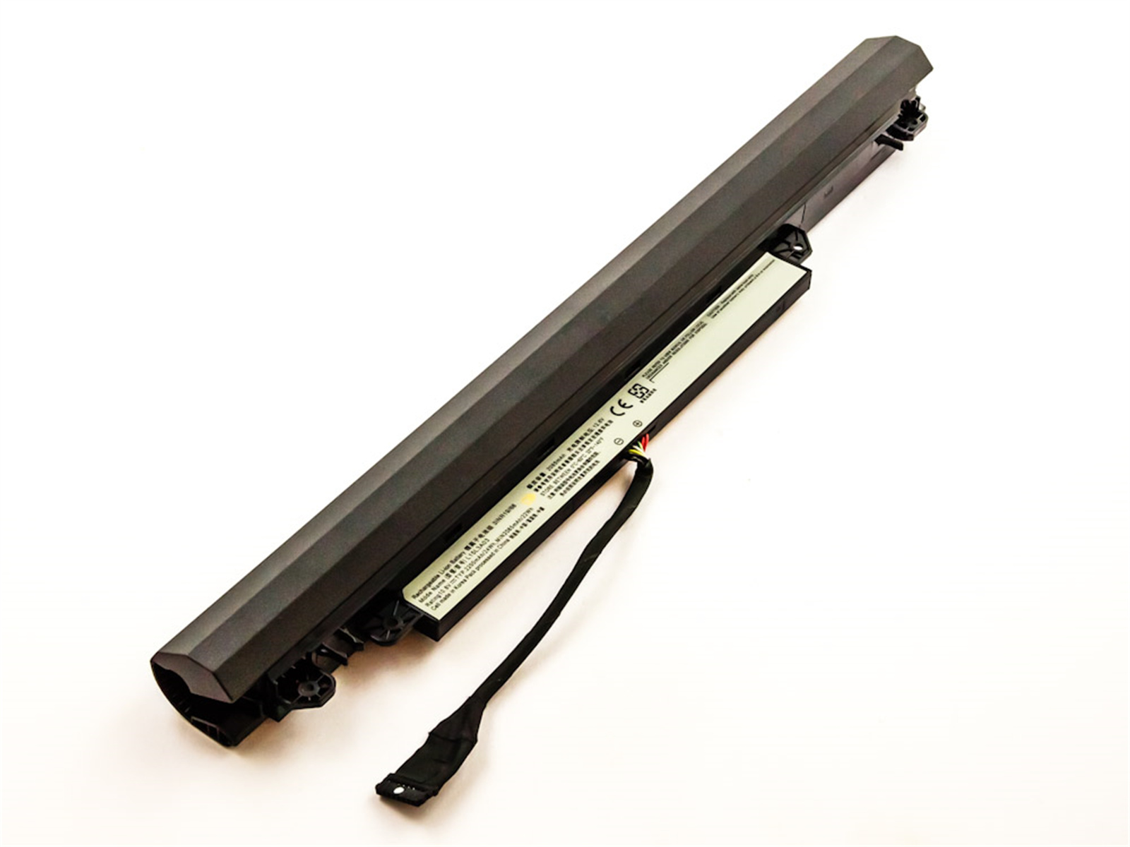 Ein langer, schwarzer Laptop-Akku mit Etikett und Stecker.