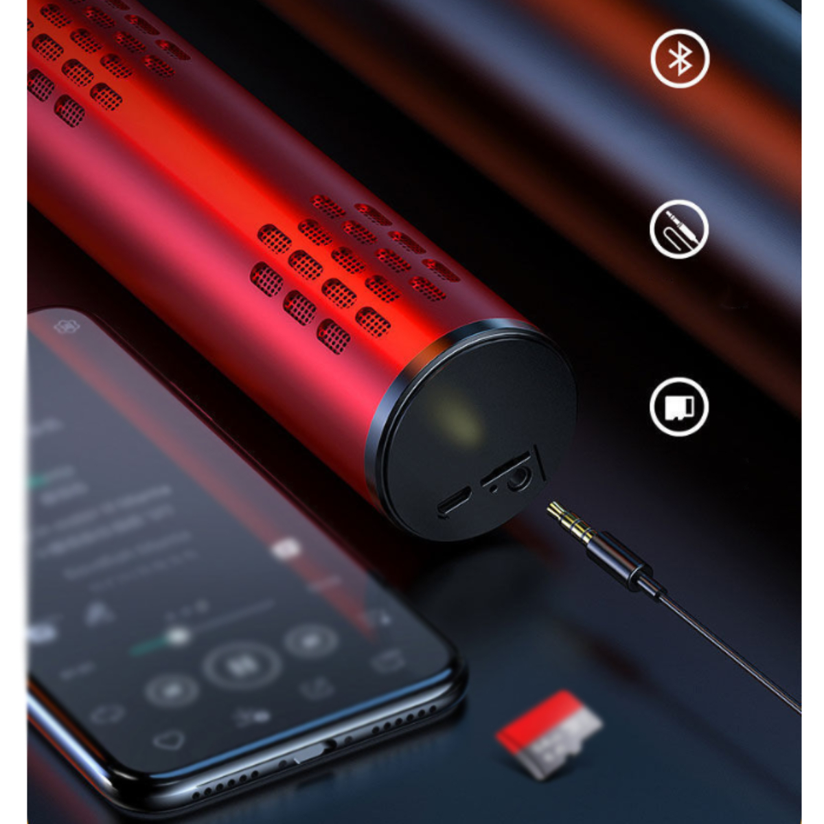 Roter Lautsprecher mit Telefon und eingestecktem Kabel.