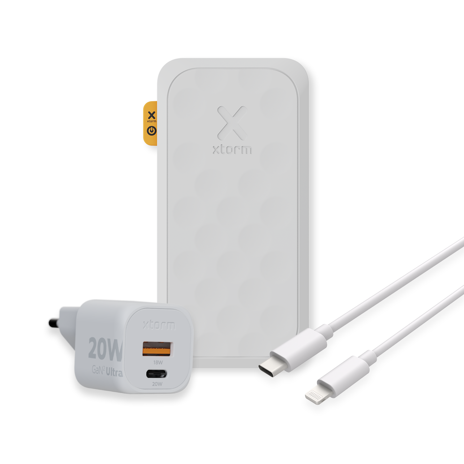 Eine weiße Powerbank, ein Ladegerät und zwei weiße Kabel. Das Ladegerät hat 20W.