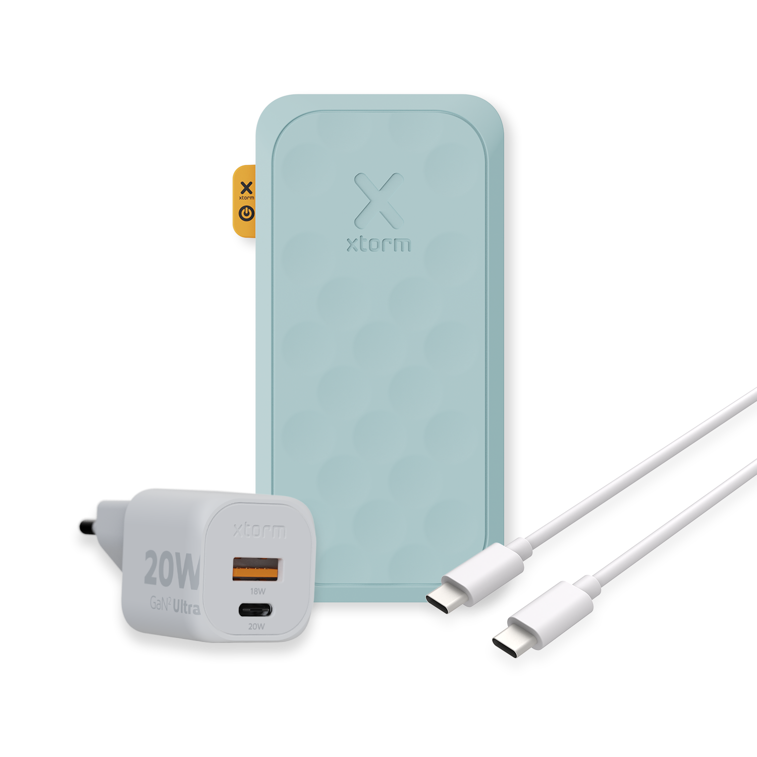 Eine blaue Powerbank, ein weißes Ladegerät und zwei weiße Kabel. Das Ladegerät hat 20W Ausgangsleistung.
