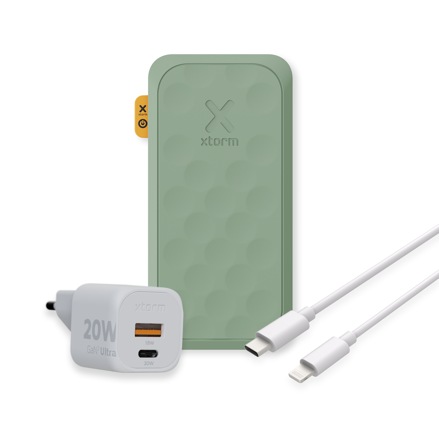 Grüne Powerbank, weißes Ladekabel und weißes Ladegerät vor schwarzem Hintergrund.
