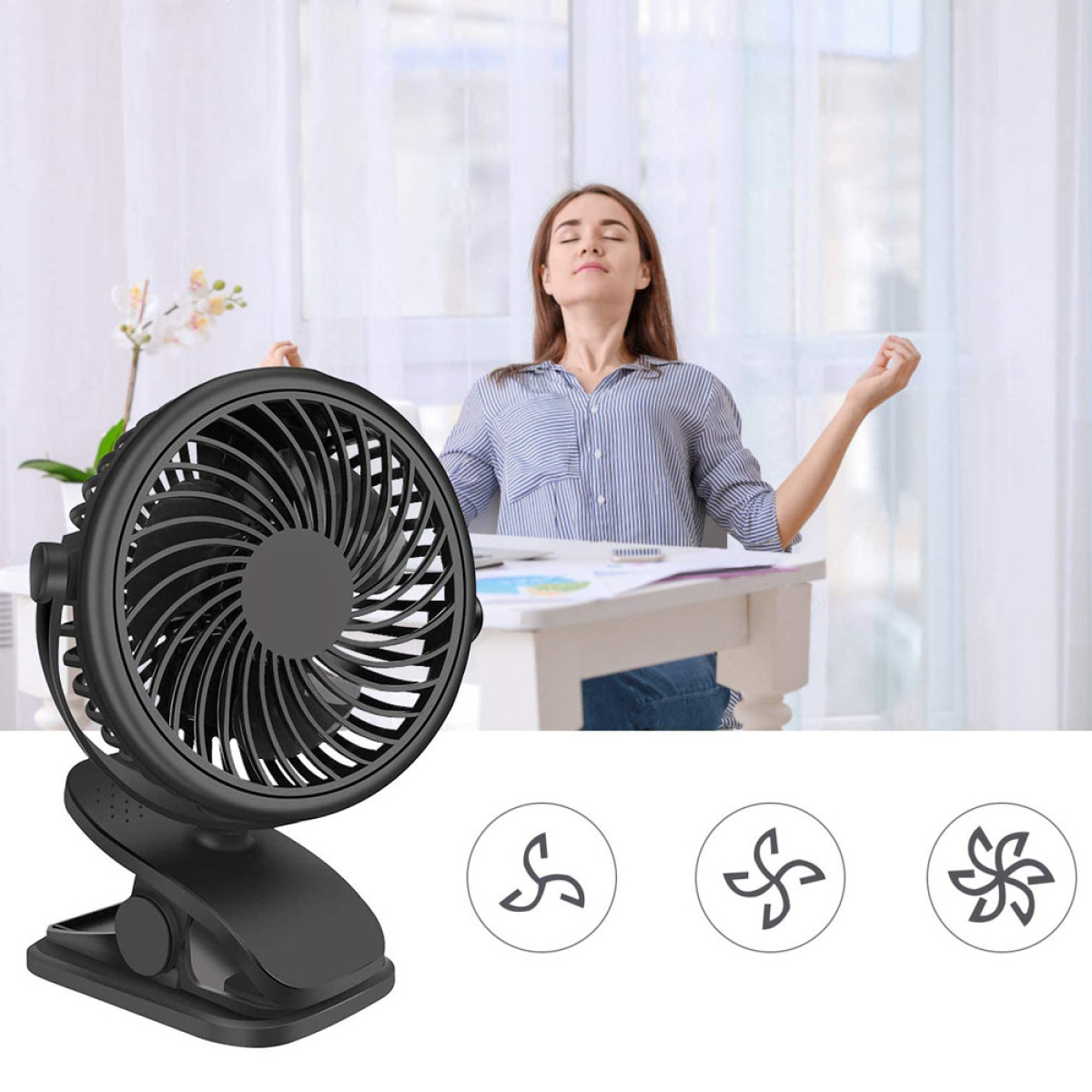 Ein schwarzer Clip-on-Ventilator mit einer Frau im Hintergrund. Der Ventilator ist auf weißem Grund.