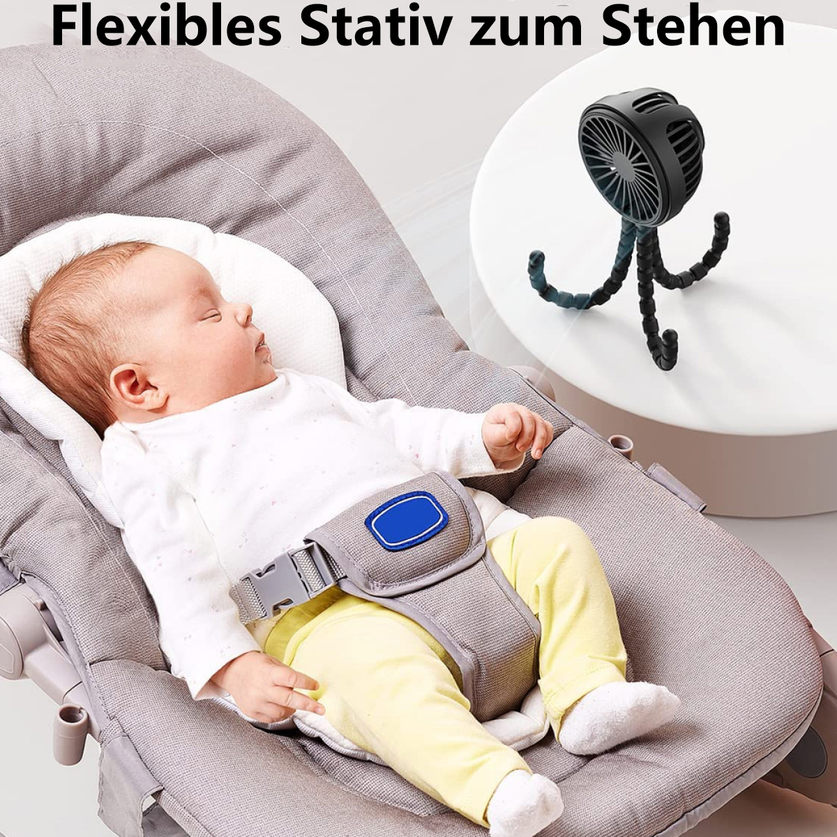 Baby auf einer grauen Babywippe. Kleiner Ventilator über dem Baby.