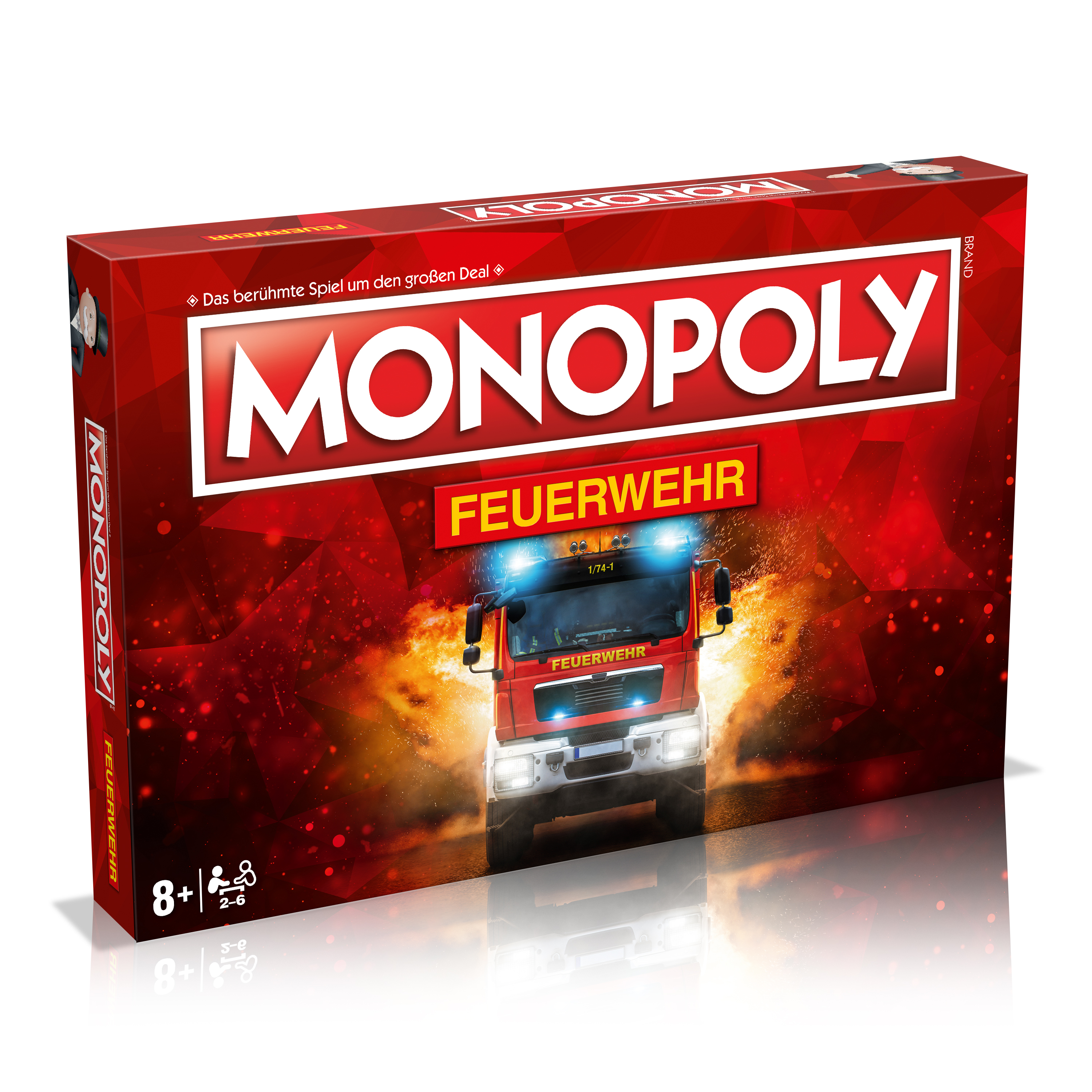 Monopoly-Brettspielbox mit einem Feuerwehrauto auf rotem Hintergrund.