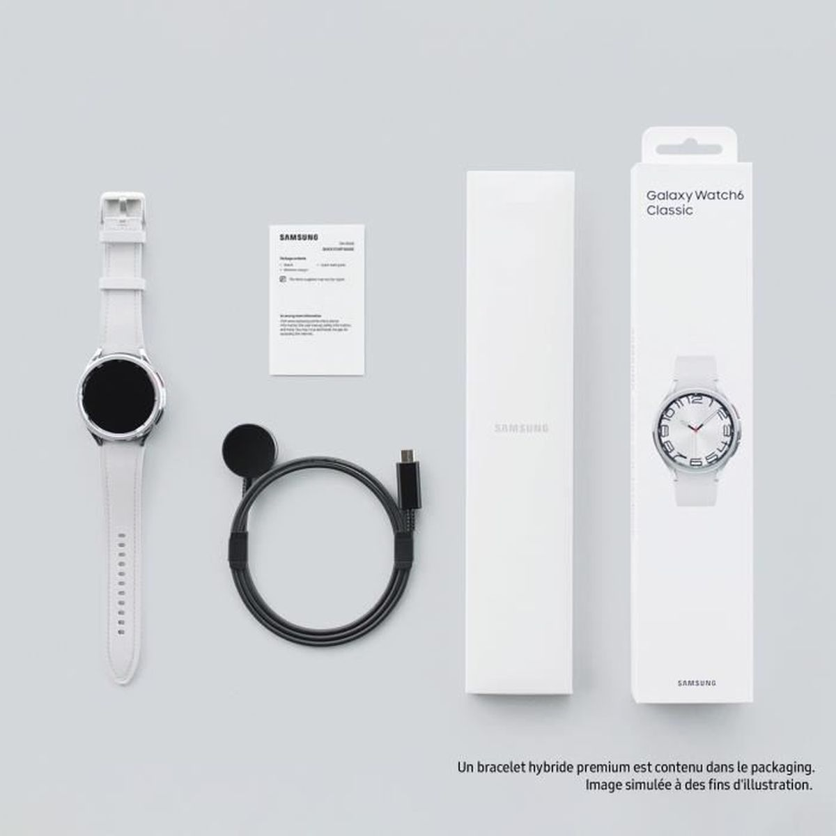 Samsung Galaxy Watch6 Classic, accessori e confezione su una superficie bianca.