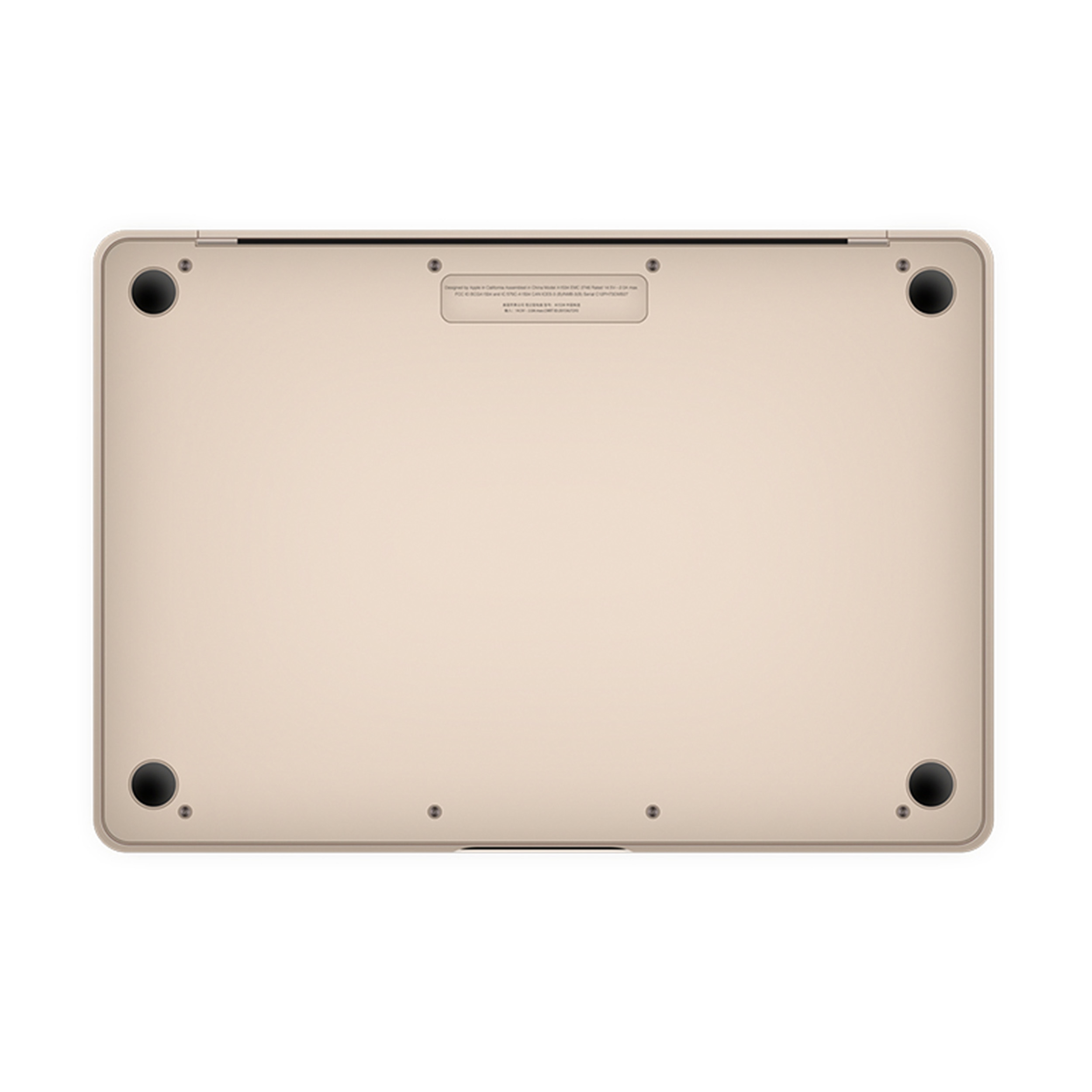 Die Unterseite eines goldenen Laptops mit schwarzen Füßen. Es gibt Schrauben und ein Etikett mit Text.