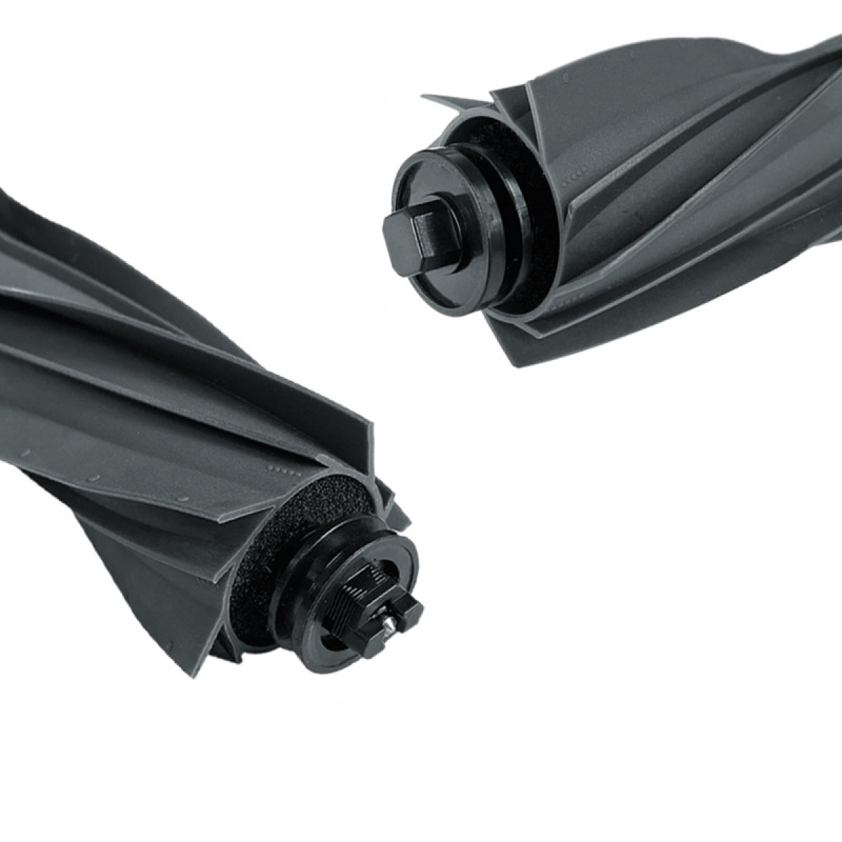 Zbliżenie dwóch czarnych głowic szczotkowych do odkurzacza. Widoczny spiralny wzór.