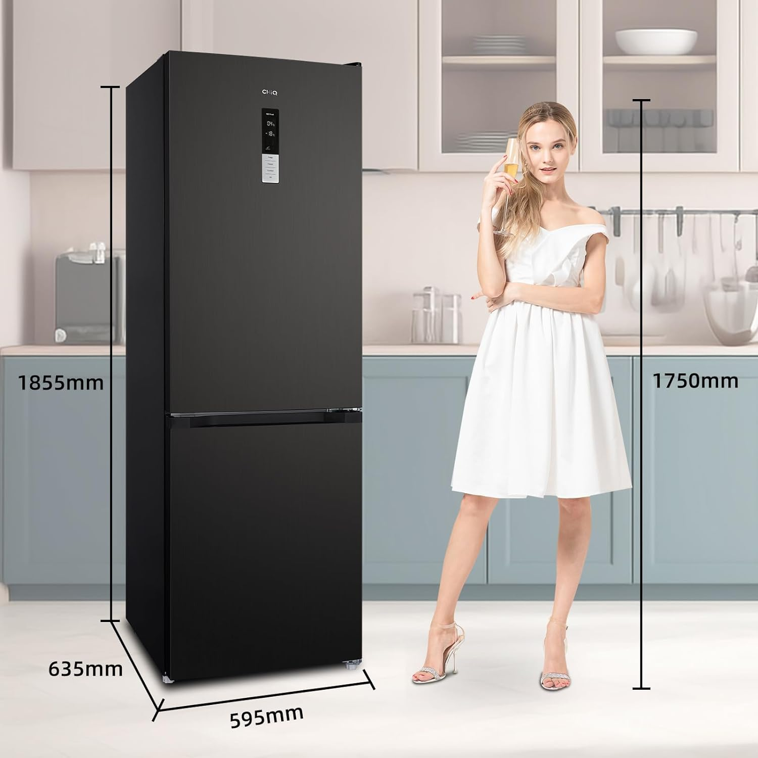 Black refrigerator in a kitchen. A woman in a white dress stands beside the fridge.