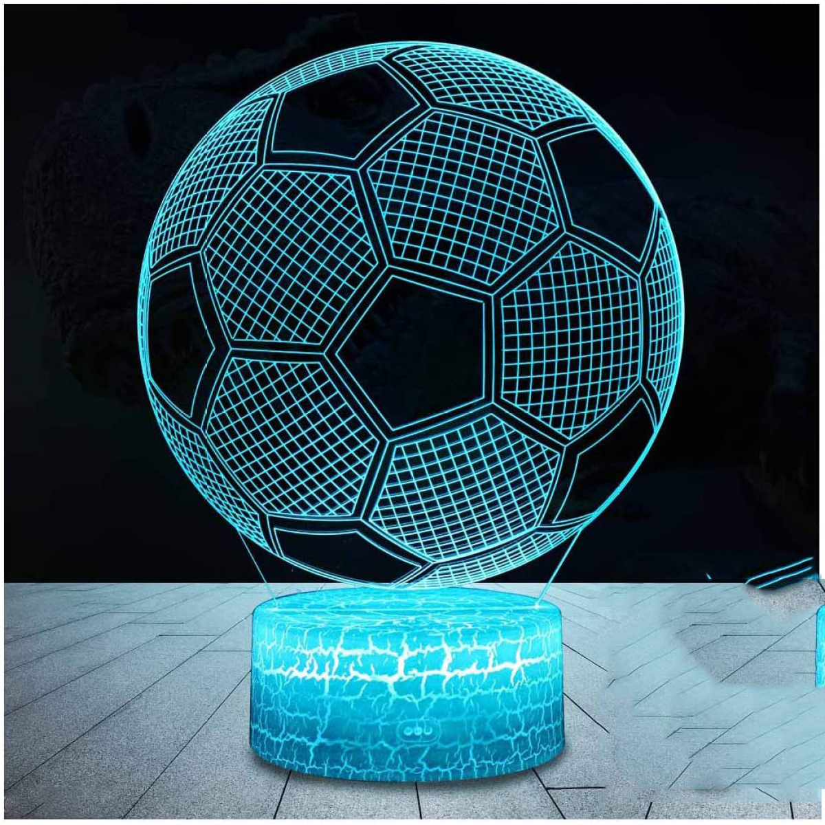 Fußballförmige Lampe mit blauem Lichtdesign. Die Basis ist ebenfalls blau mit Mustern.