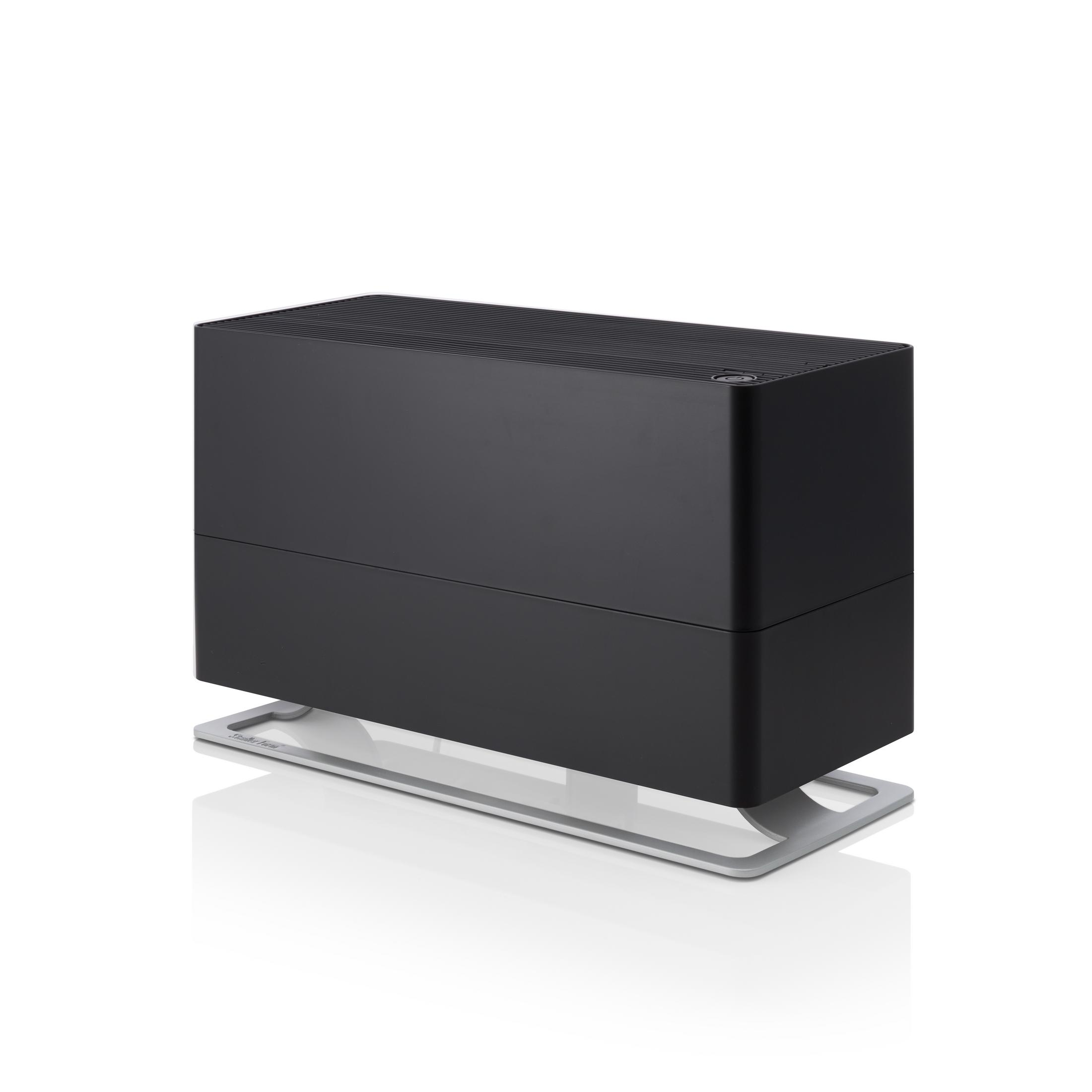 Un humidificateur noir sur un support argenté.
