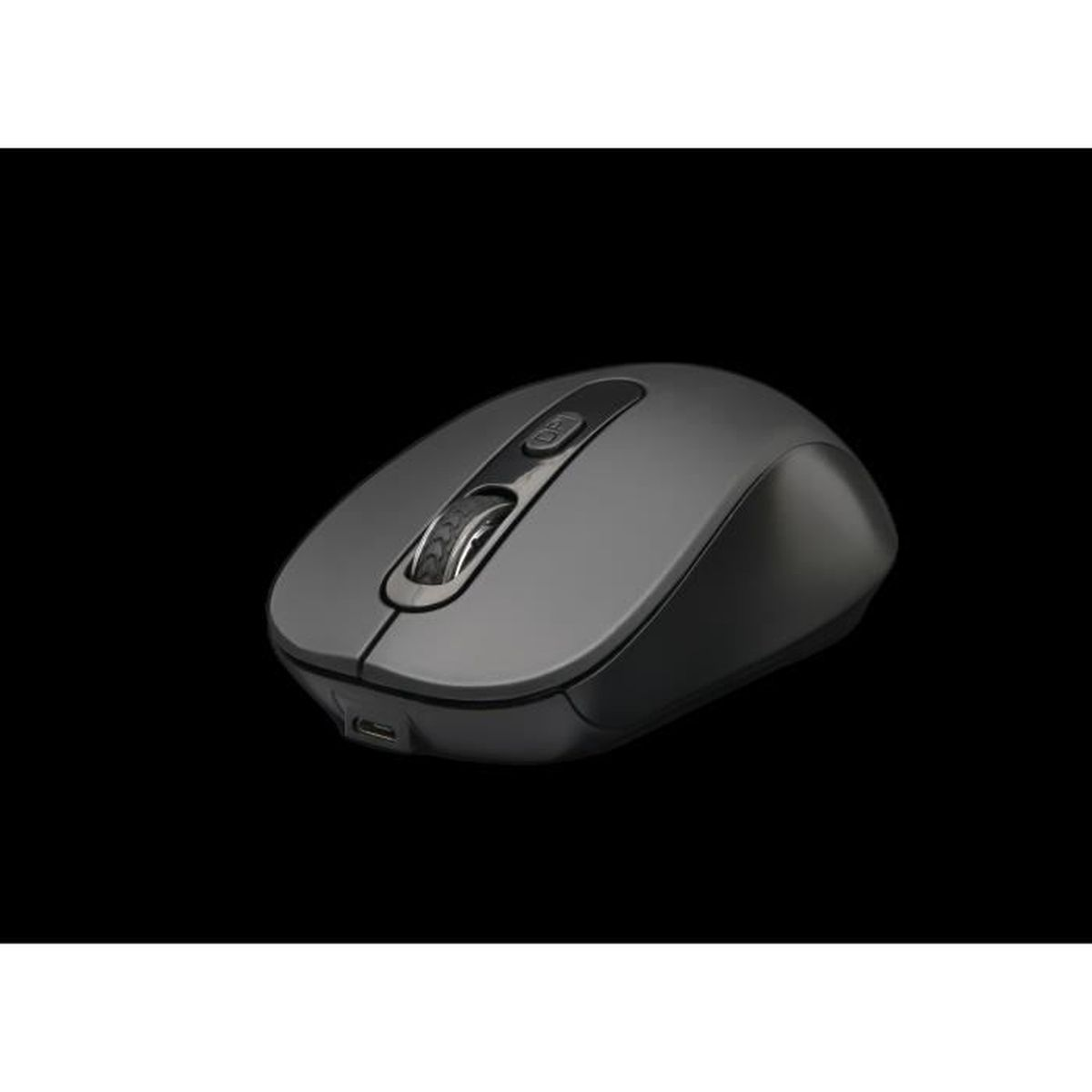 Un mouse grigio su una superficie nera. Il mouse ha una rotella di scorrimento e pulsanti laterali.