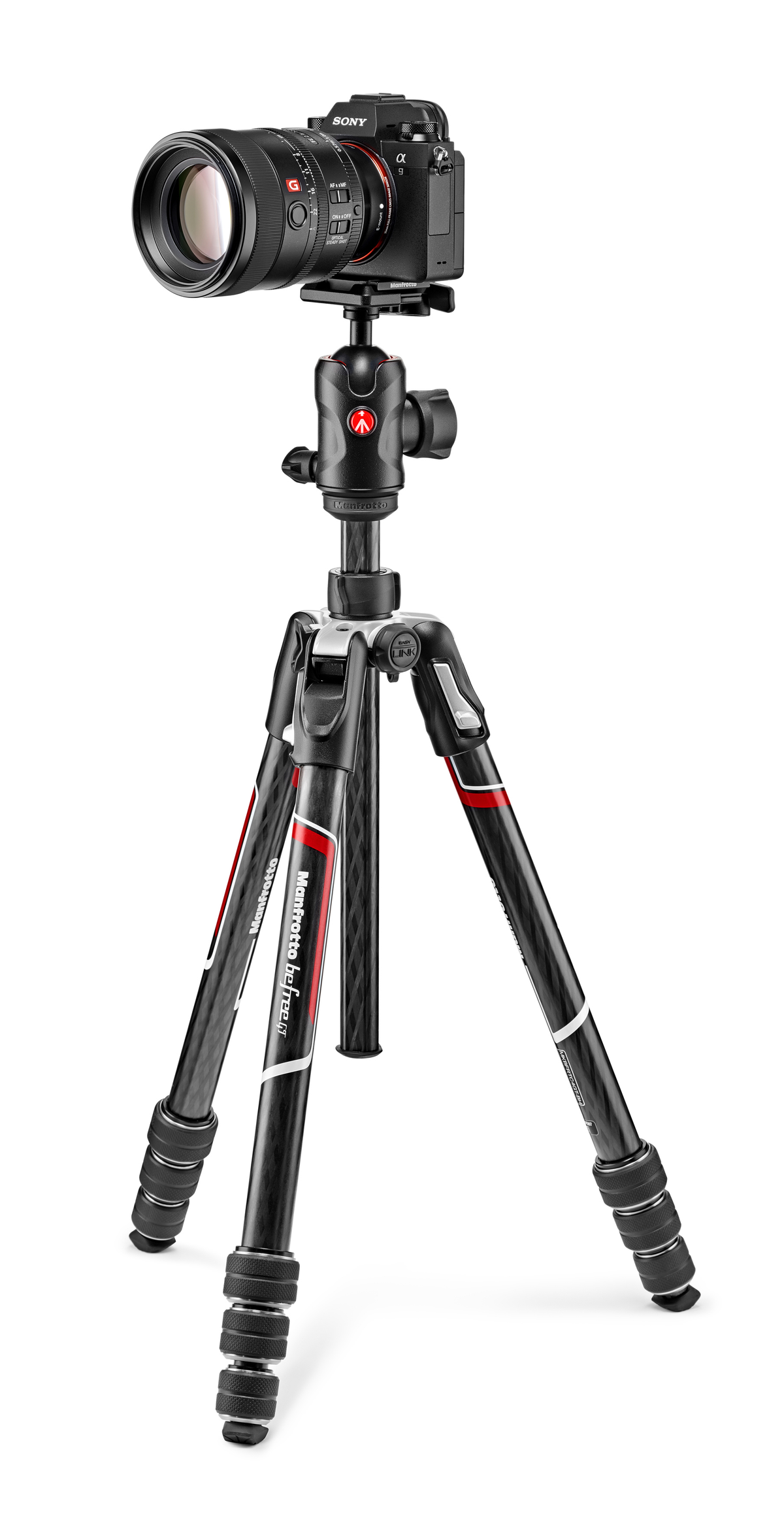 Aparat na statywie, czarny i czerwony, z białym tłem.