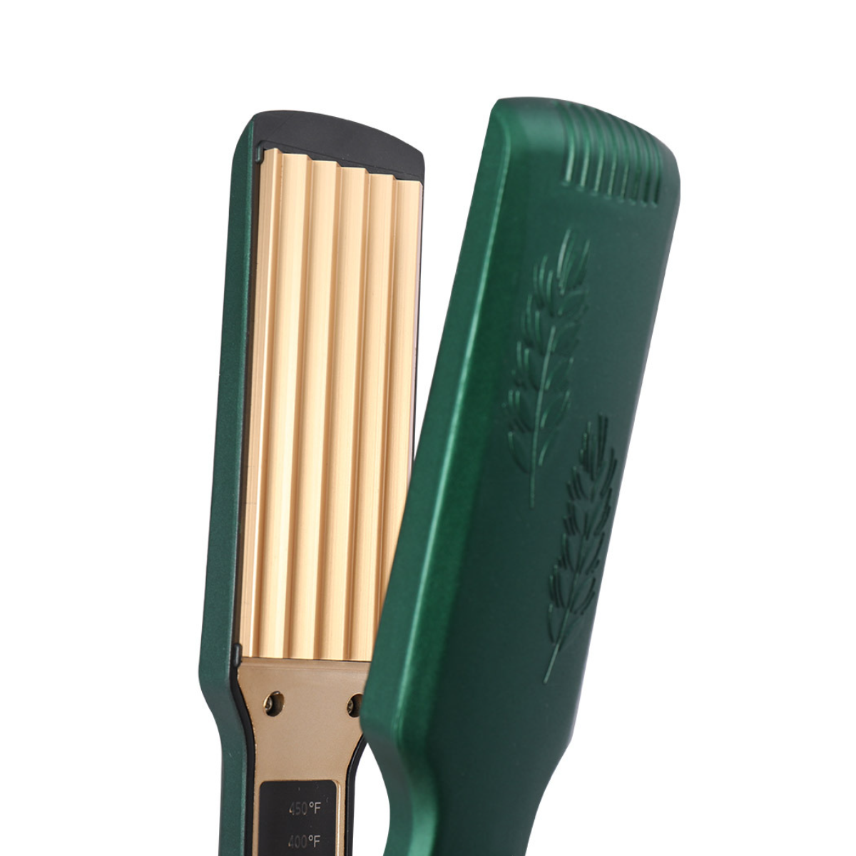 Ein grüner Haarkräusler mit goldenen Kräuselplatten, offen vor weißem Hintergrund. Die Oberseite ist grün.