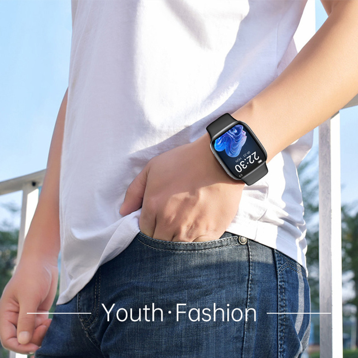Man wearing a white shirt and jeans, wearing a smartwatch on his wrist.